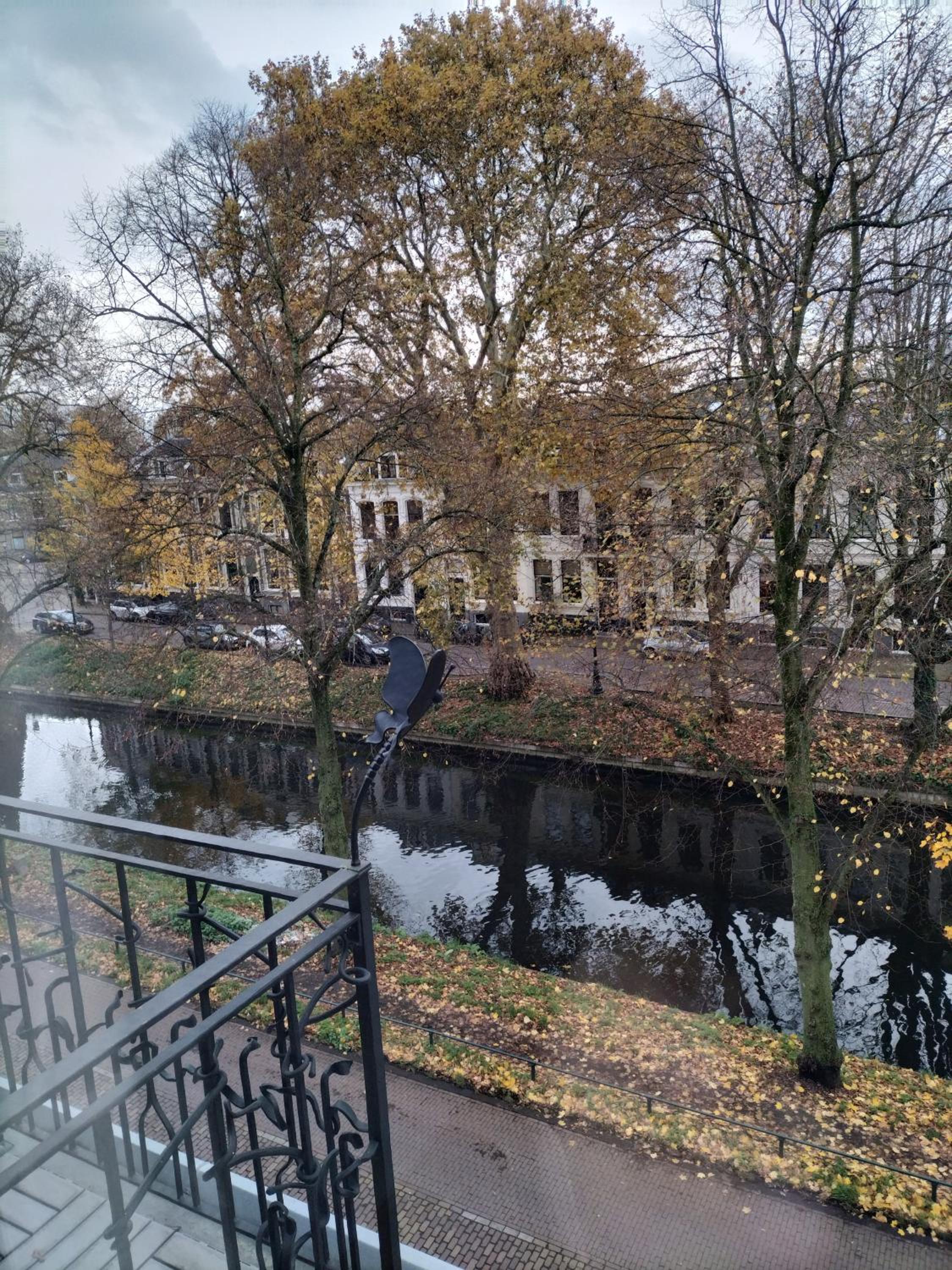 Historic canal house in green residential area view 2