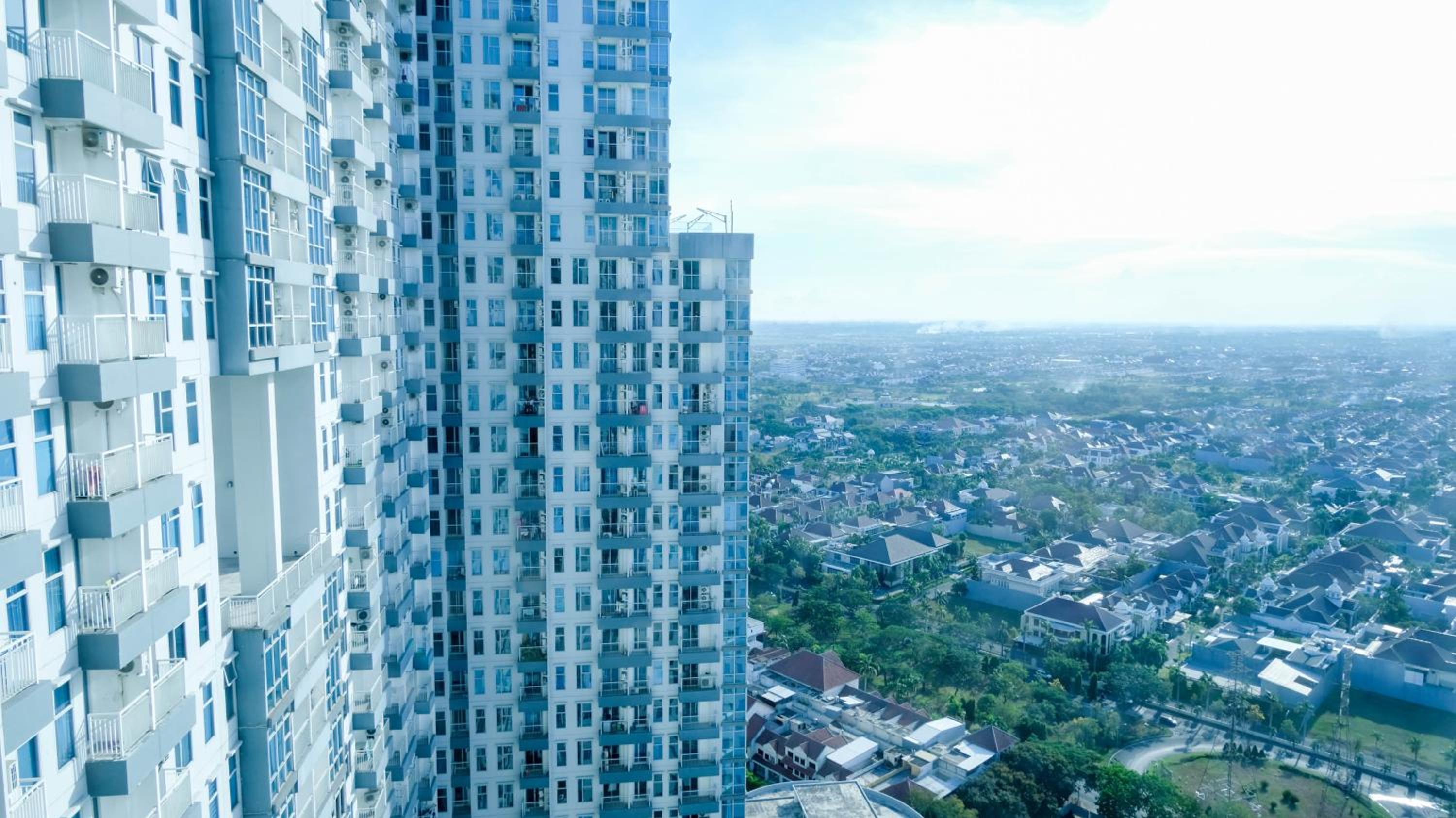 Spacey and Homey 2BR at Supermall Mansion Apartment By Travelio