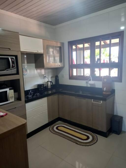 Casa aconchegante próximo a praia, 2 dormitórios