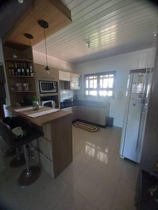 Casa aconchegante próximo a praia, 2 dormitórios