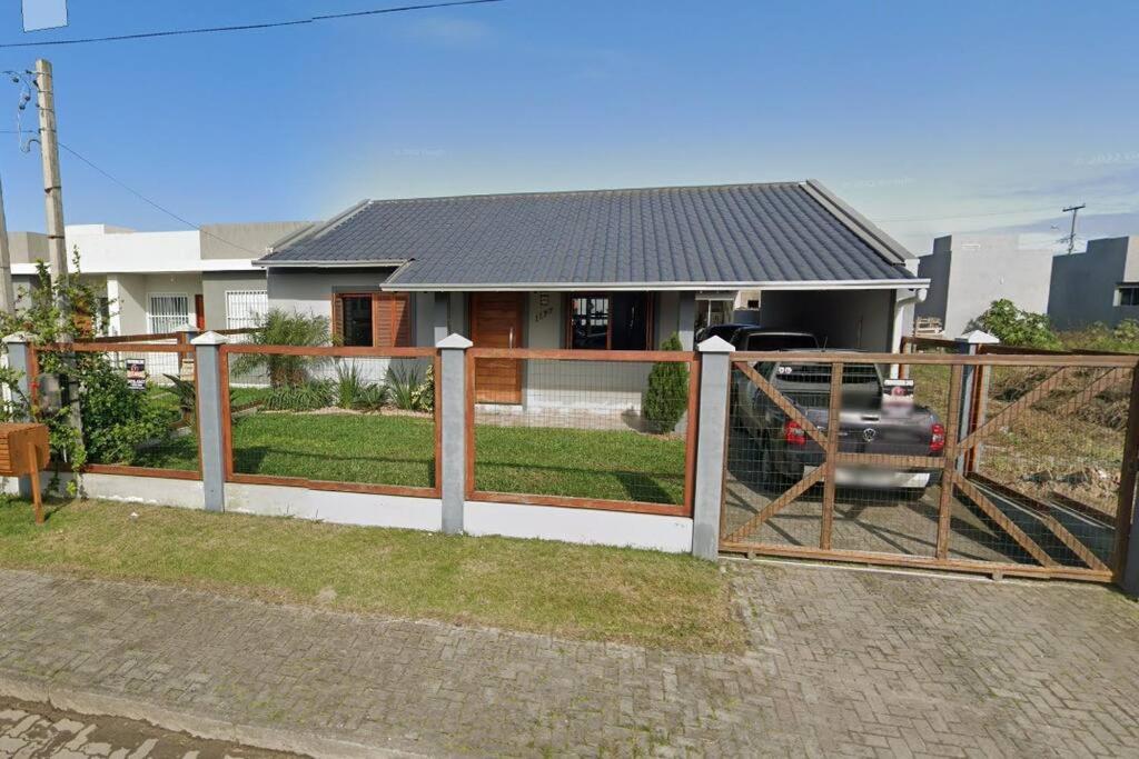 Casa aconchegante próximo a praia, 2 dormitórios