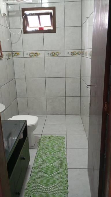 Casa pé na área