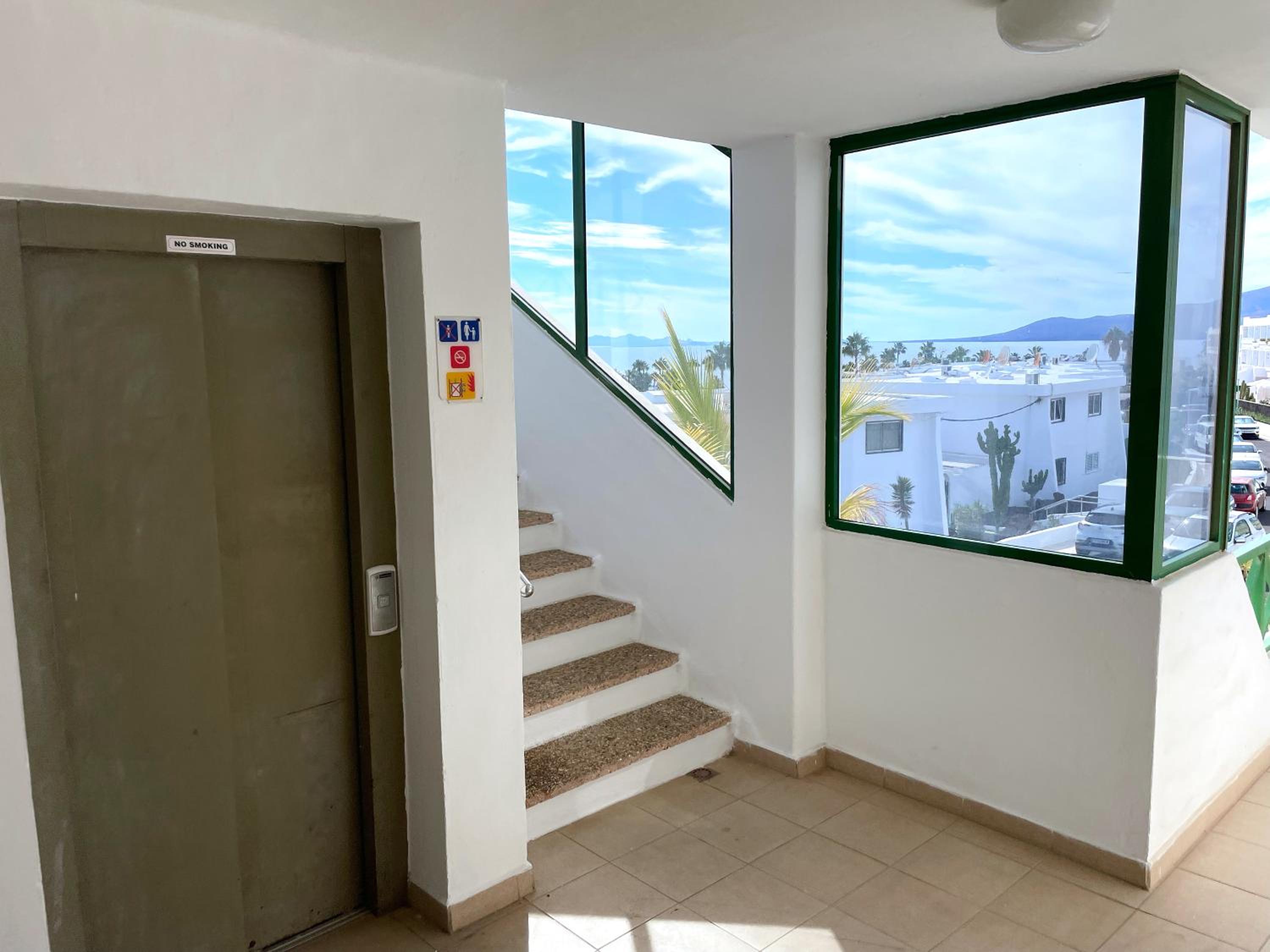 TOP FLOOR OCEAN VIEWS Lanzamar - Renovated Gem with a Sunny, Private Terrace & Elevator & Pool - Puerto del Carmen