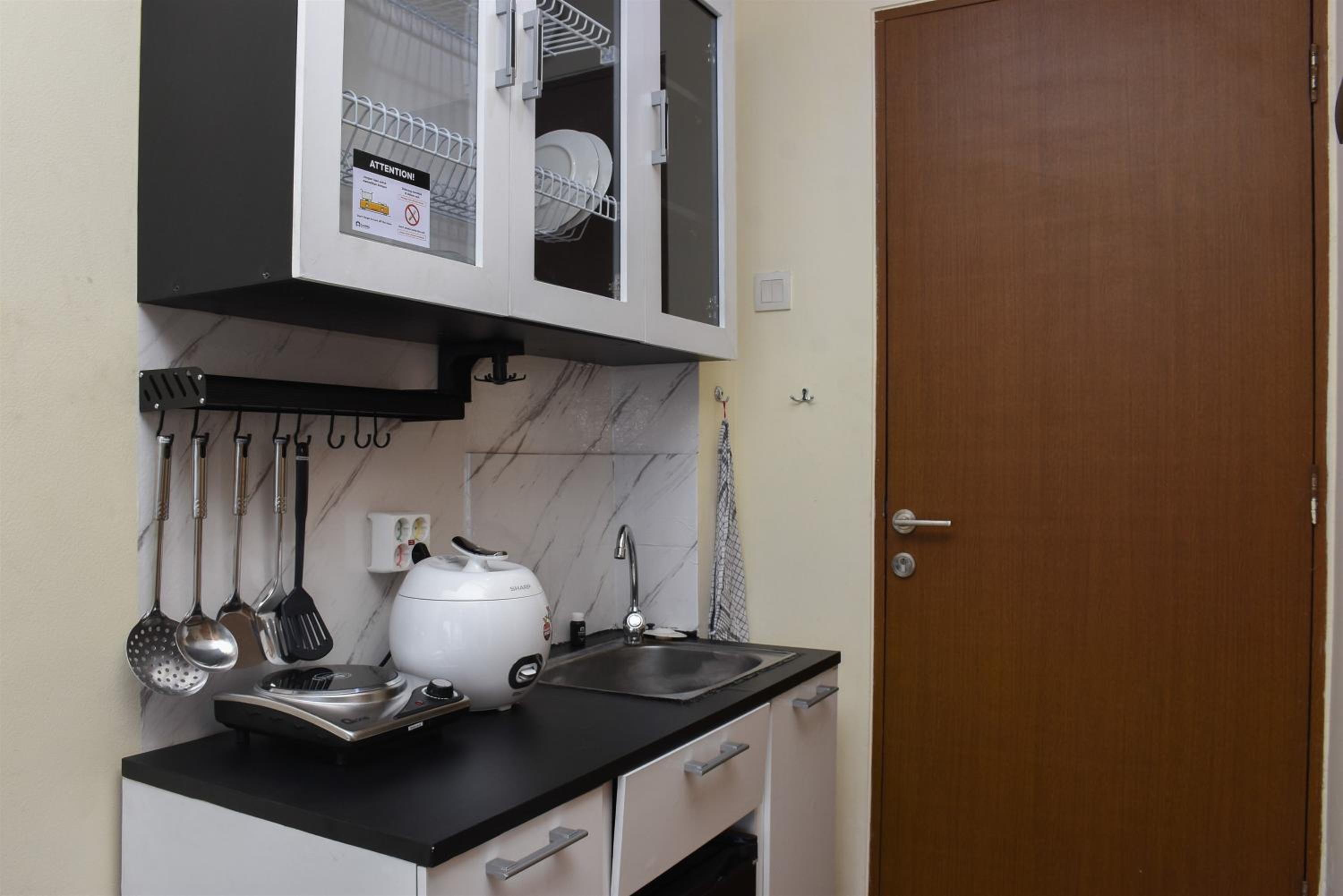 Nice and Cozy Studio at Tifolia Apartment By Travelio view 3