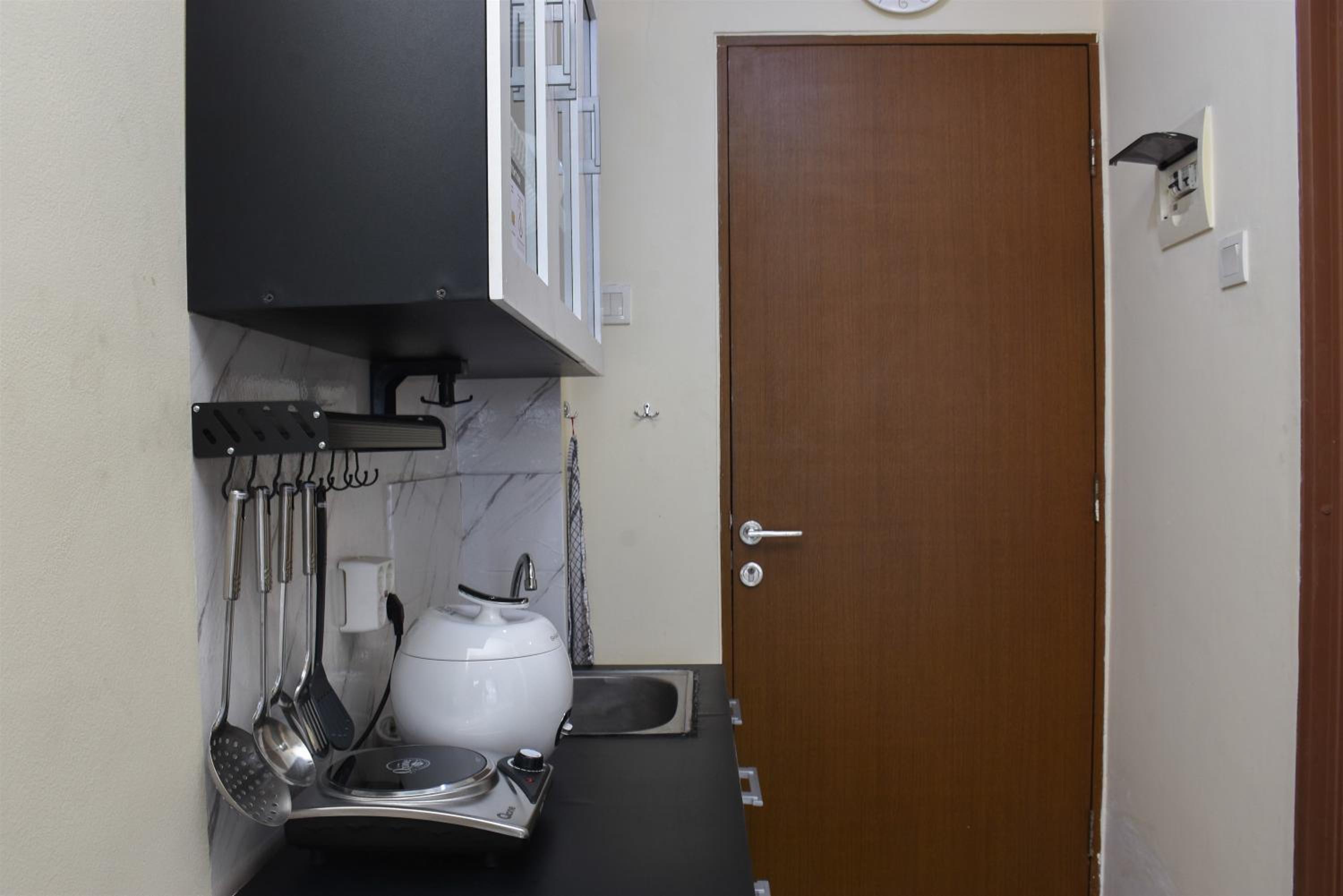Nice and Cozy Studio at Tifolia Apartment By Travelio view 5
