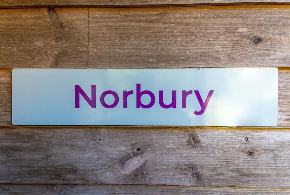 Norbury, woodland lodge with hot tub for 12
