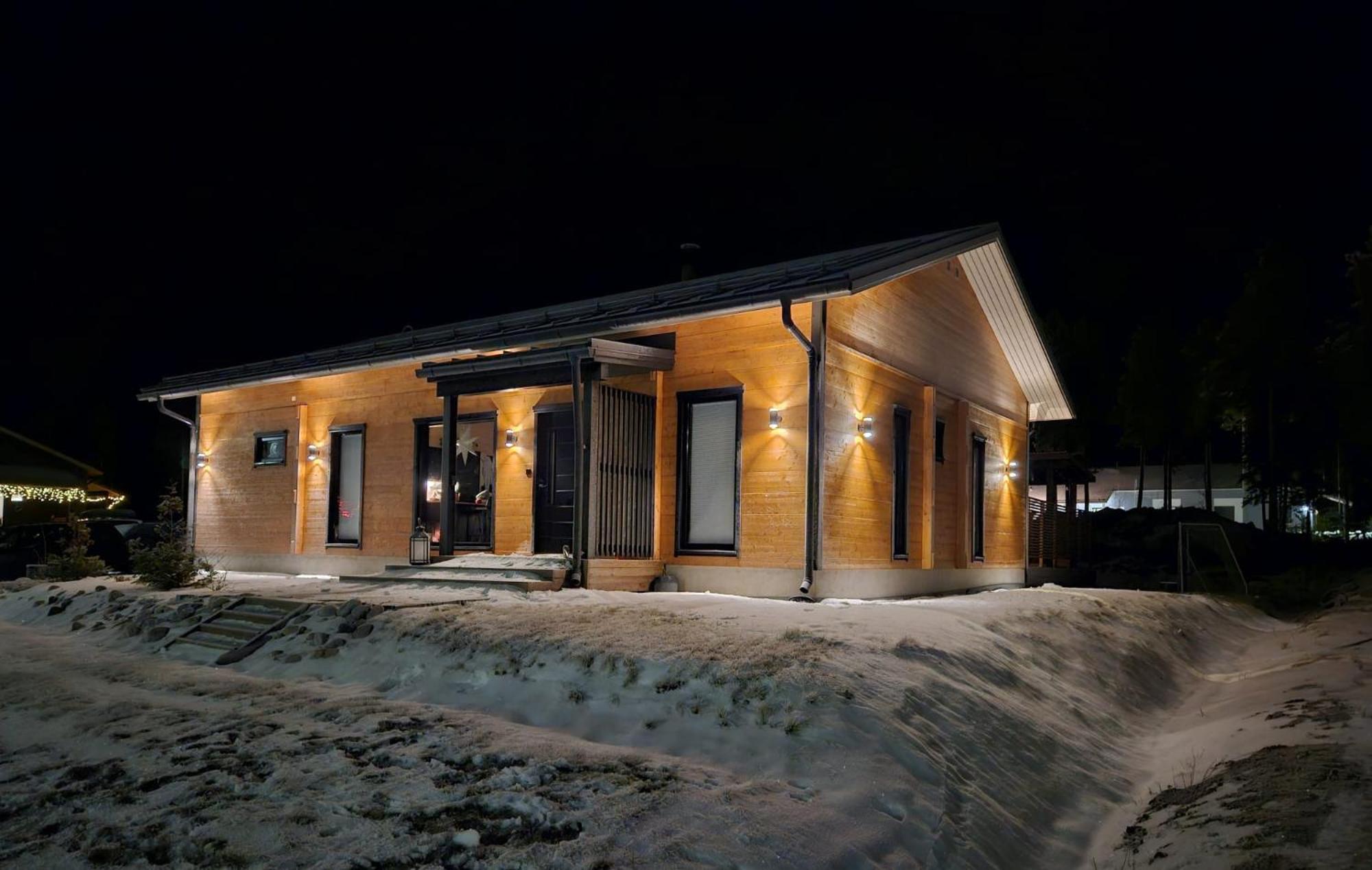 Modern log house with jacuzzi and sauna