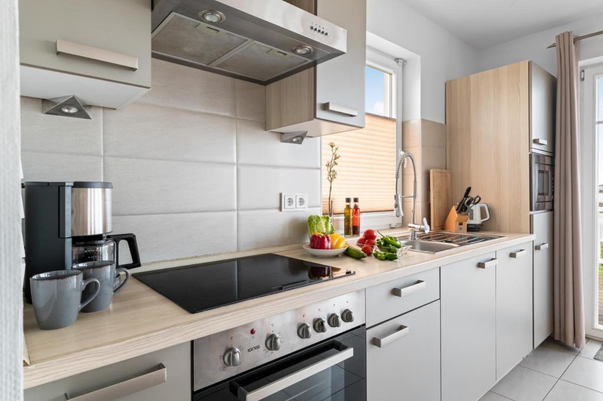Haus am Strand - Ferienwohnung für 4 in Olpenitz mit Dachterrasse, Strandzugang und Ostseeblick