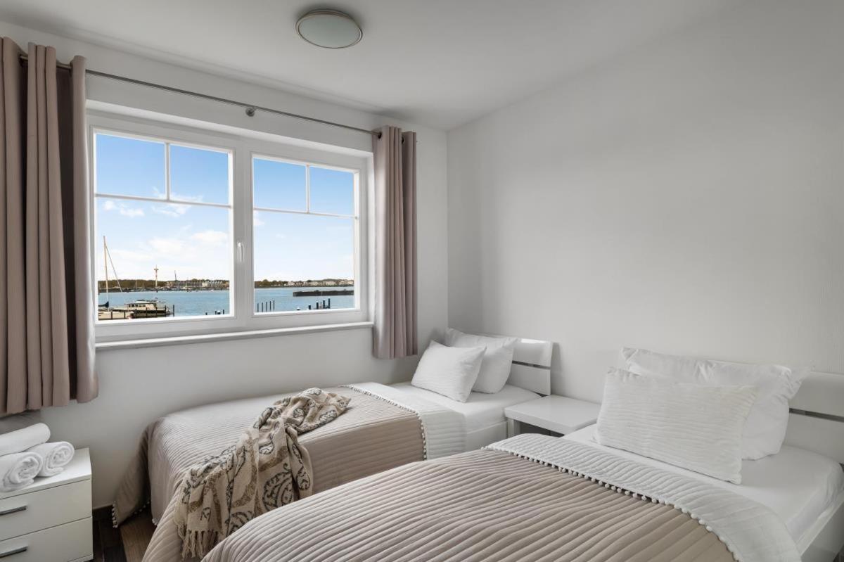Haus am Strand - Ferienwohnung für 4 in Olpenitz mit Dachterrasse, Strandzugang und Ostseeblick