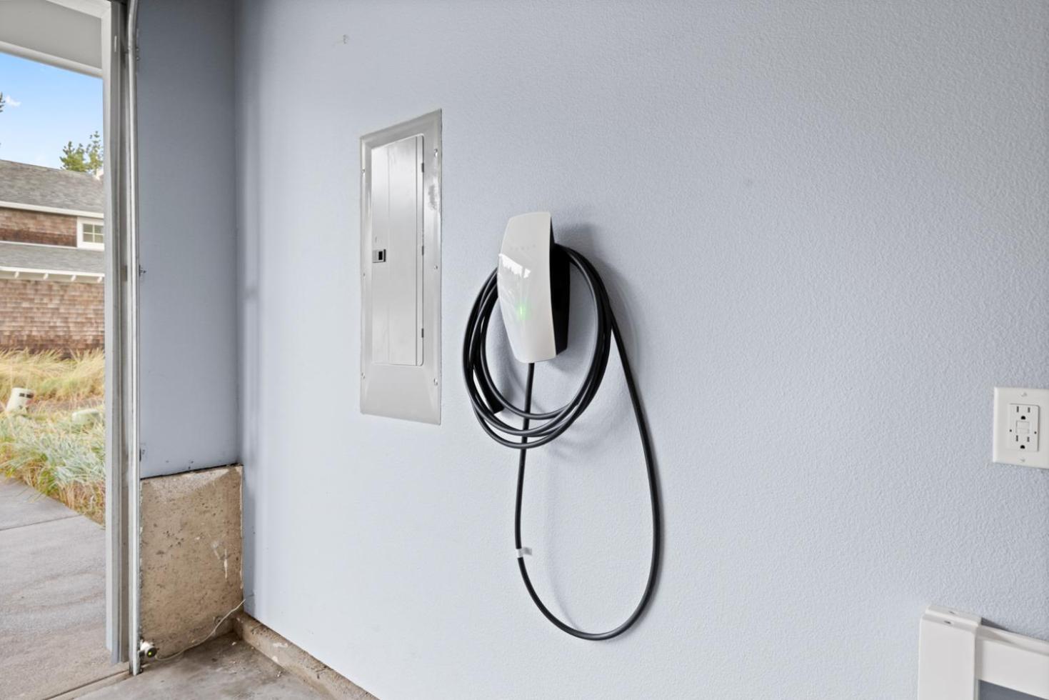 Coastal retreat house with electric vehicle station