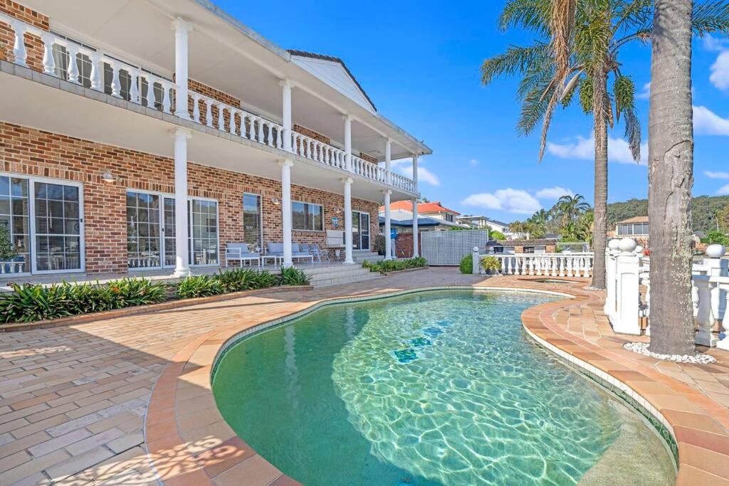 Stunning 4BR Holiday Home with Water Views & Pool