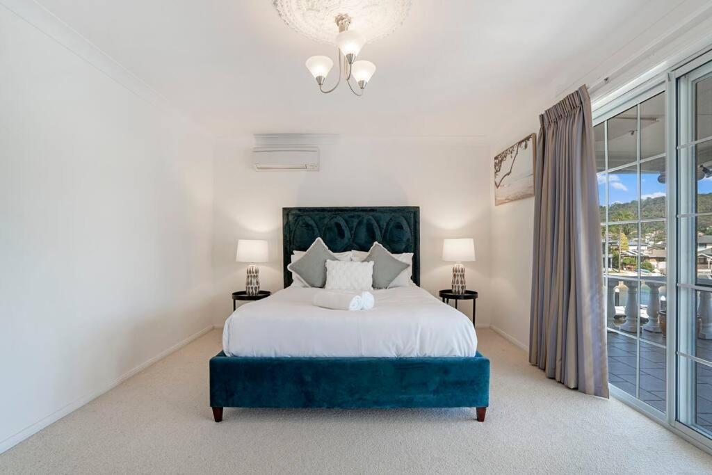 Stunning 4BR Holiday Home with Water Views & Pool