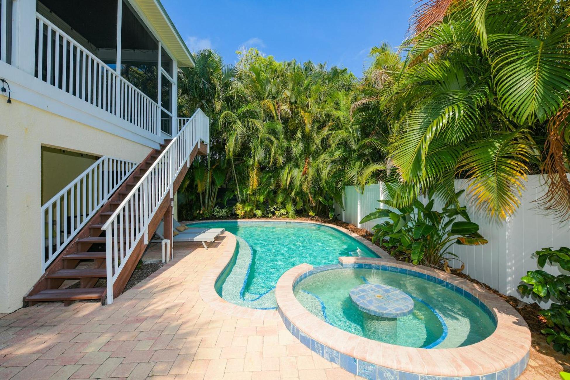 Mango Bay - Gorgeously Renovated Spacious Home wPool Spa Game Room Bikes Walk to Beach view 4