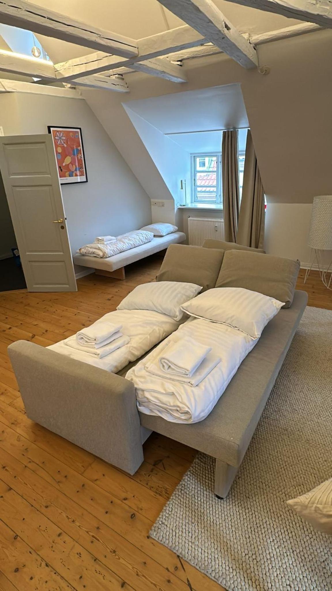 Unique Apartment w Exposed Beams Next to Tivoli