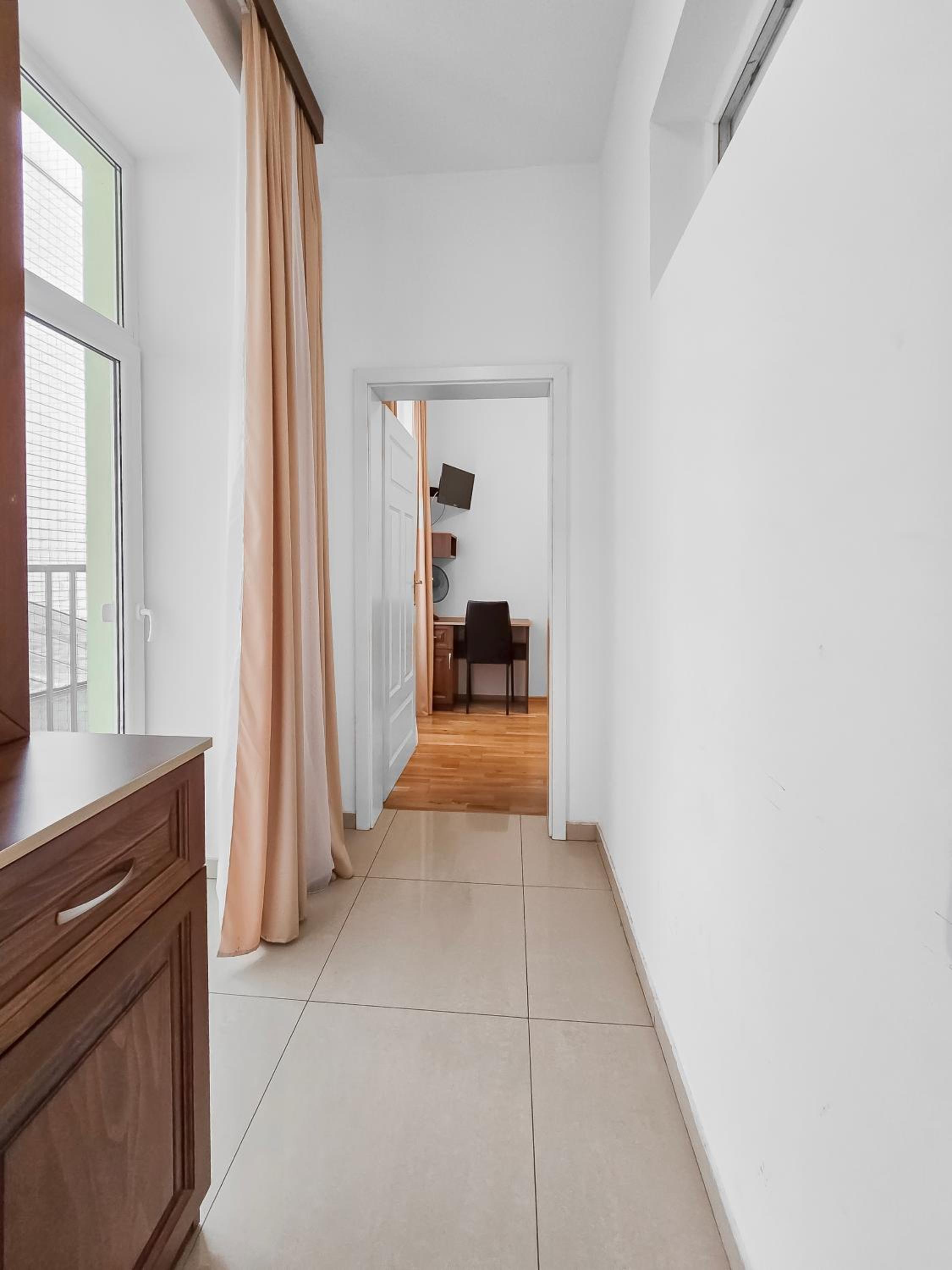 Spacious 3-Bedroom Retreat with Balcony for 8 Near Millennium Tower