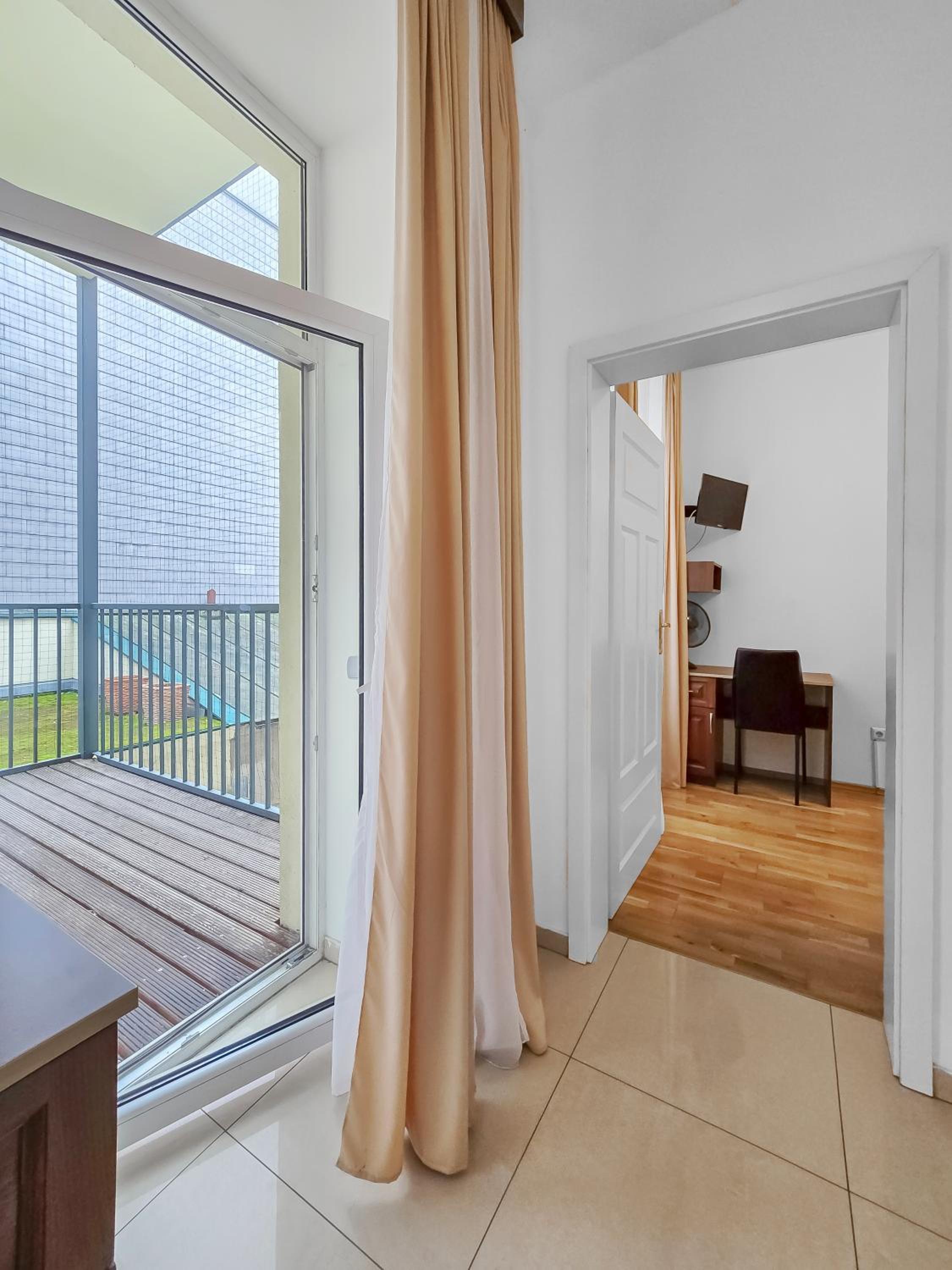 Spacious 3-Bedroom Retreat with Balcony for 8 Near Millennium Tower