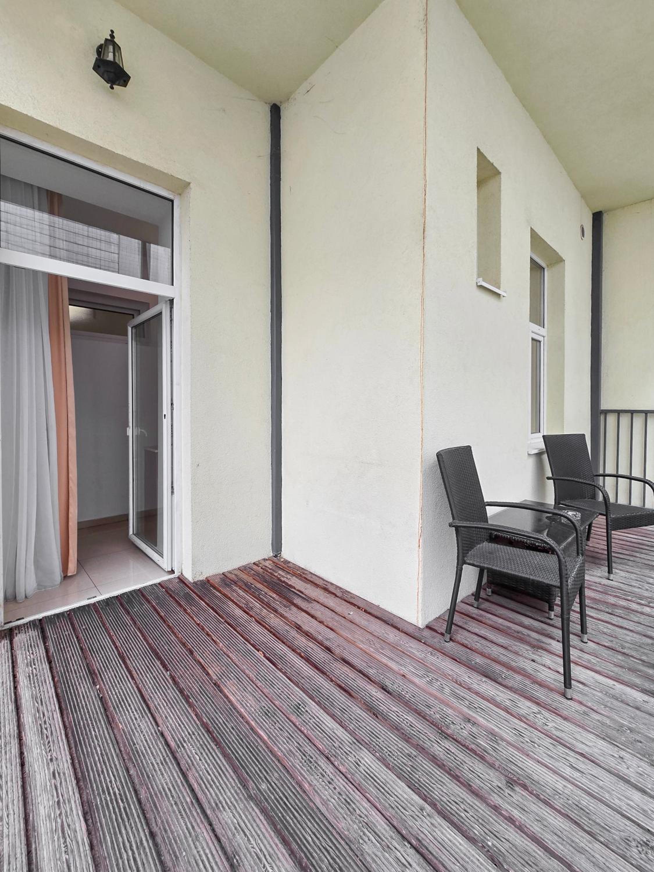 Spacious 3-Bedroom Retreat with Balcony for 8 Near Millennium Tower