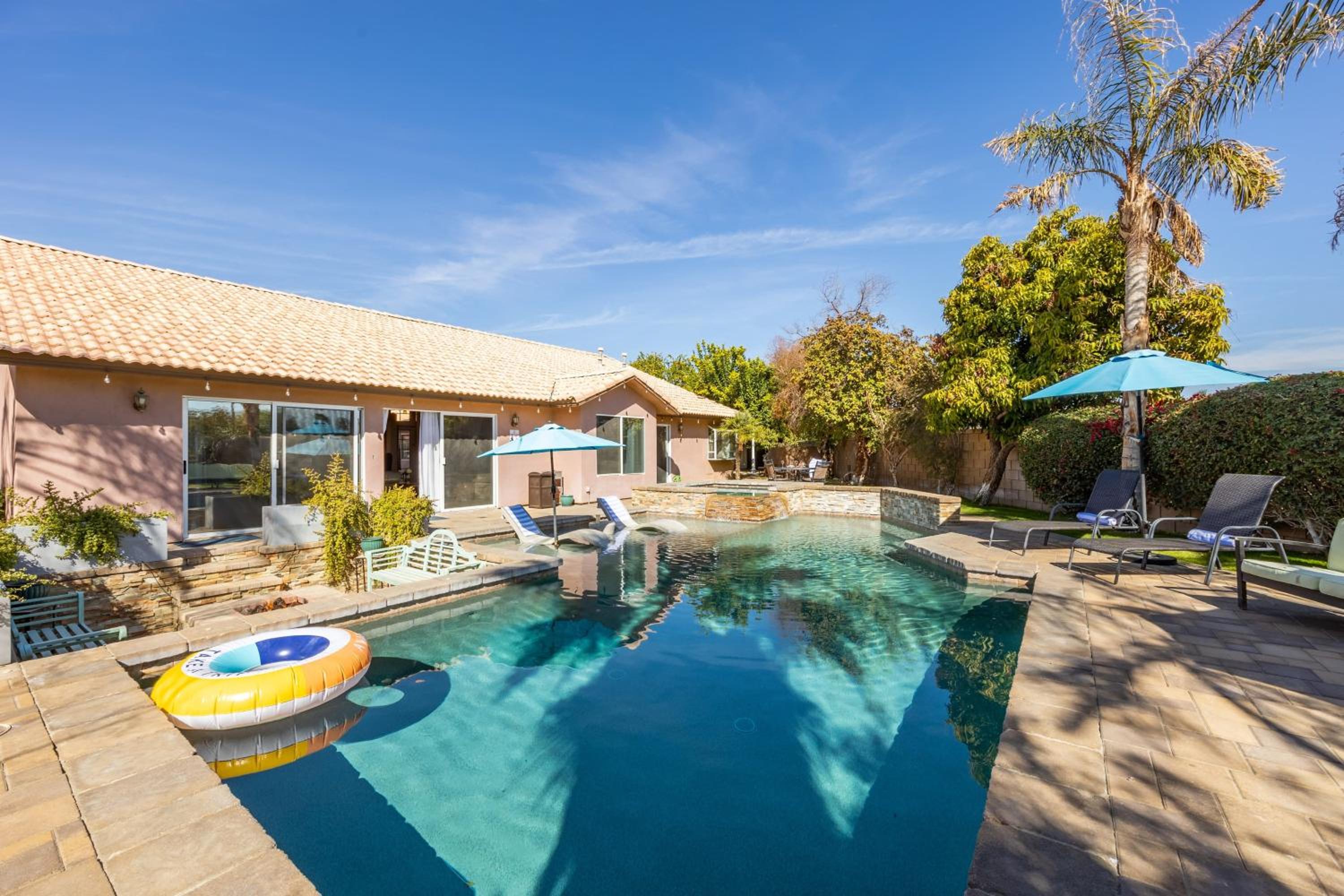 Luxury Oasis w Pool Hot Tub Fire Pit Games Big Yard Larrea by AvantStay