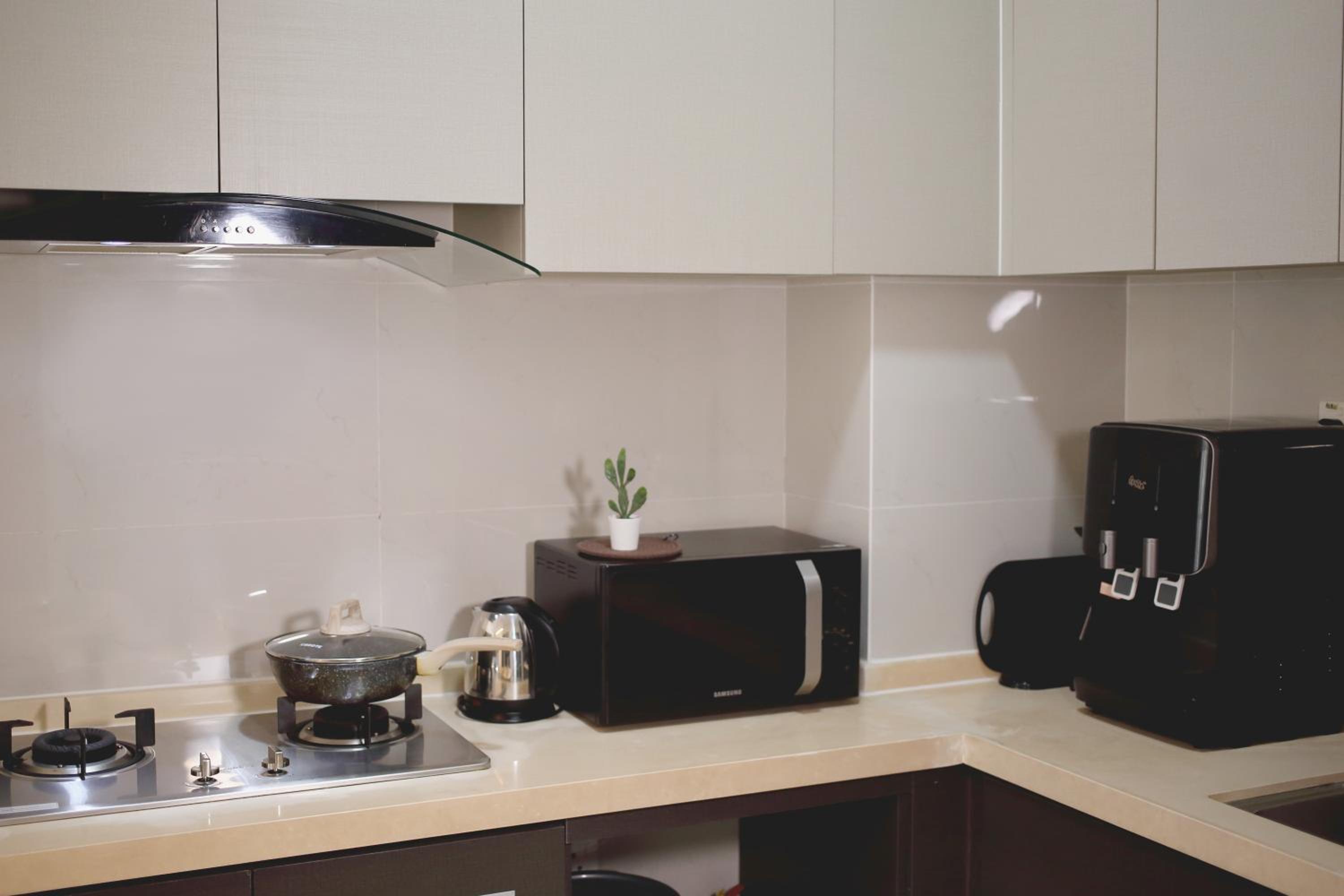 Cozy Beach Escape: 2BR Muji Gem