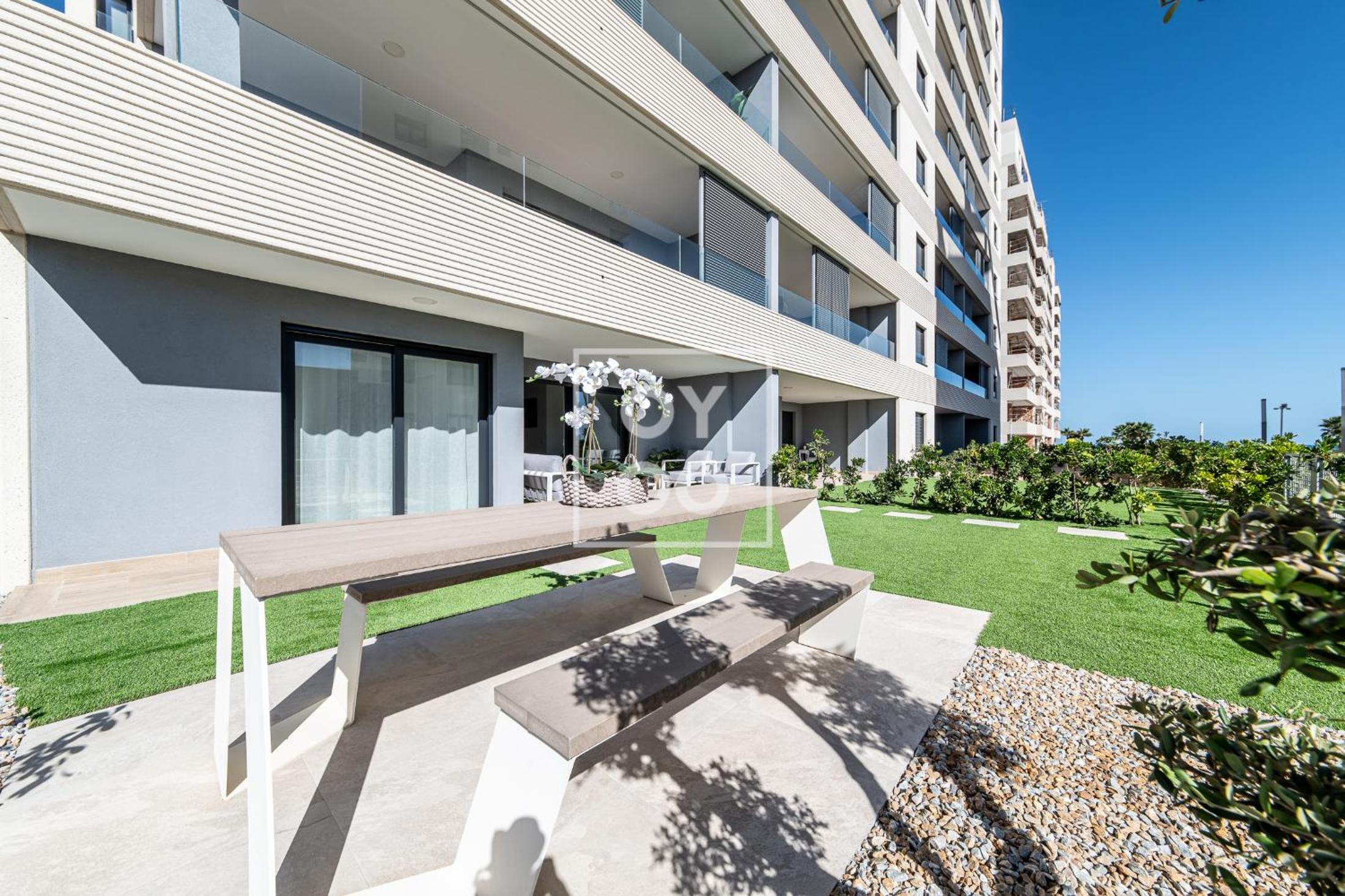 Infinity Blue groundfloor apt, beachfront, heated pool - by OYOOSTAYS
