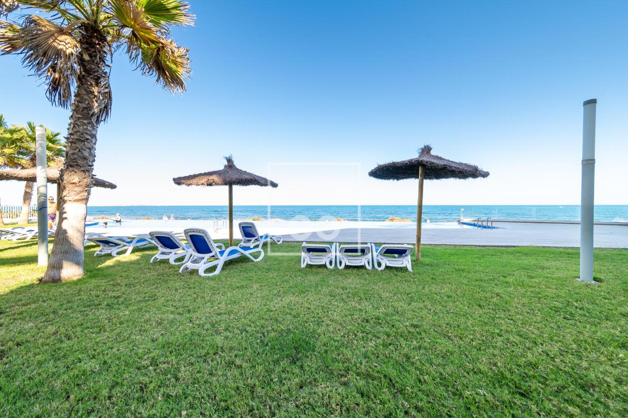 Infinity Blue groundfloor apt, beachfront, heated pool - by OYOOSTAYS
