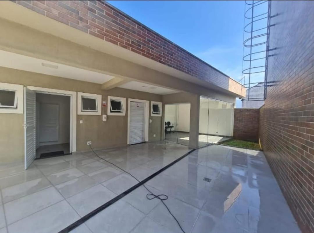 Casa em condomínio no Centro de Bertioga com Ar condicionado