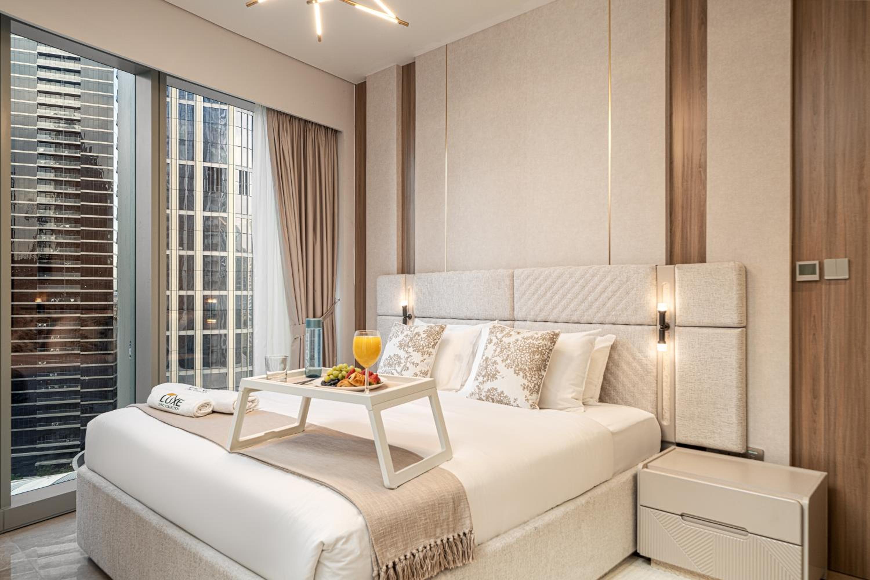 Luxe Living at Grande Signature - Burj Khalifa and Sea Views - Brand New