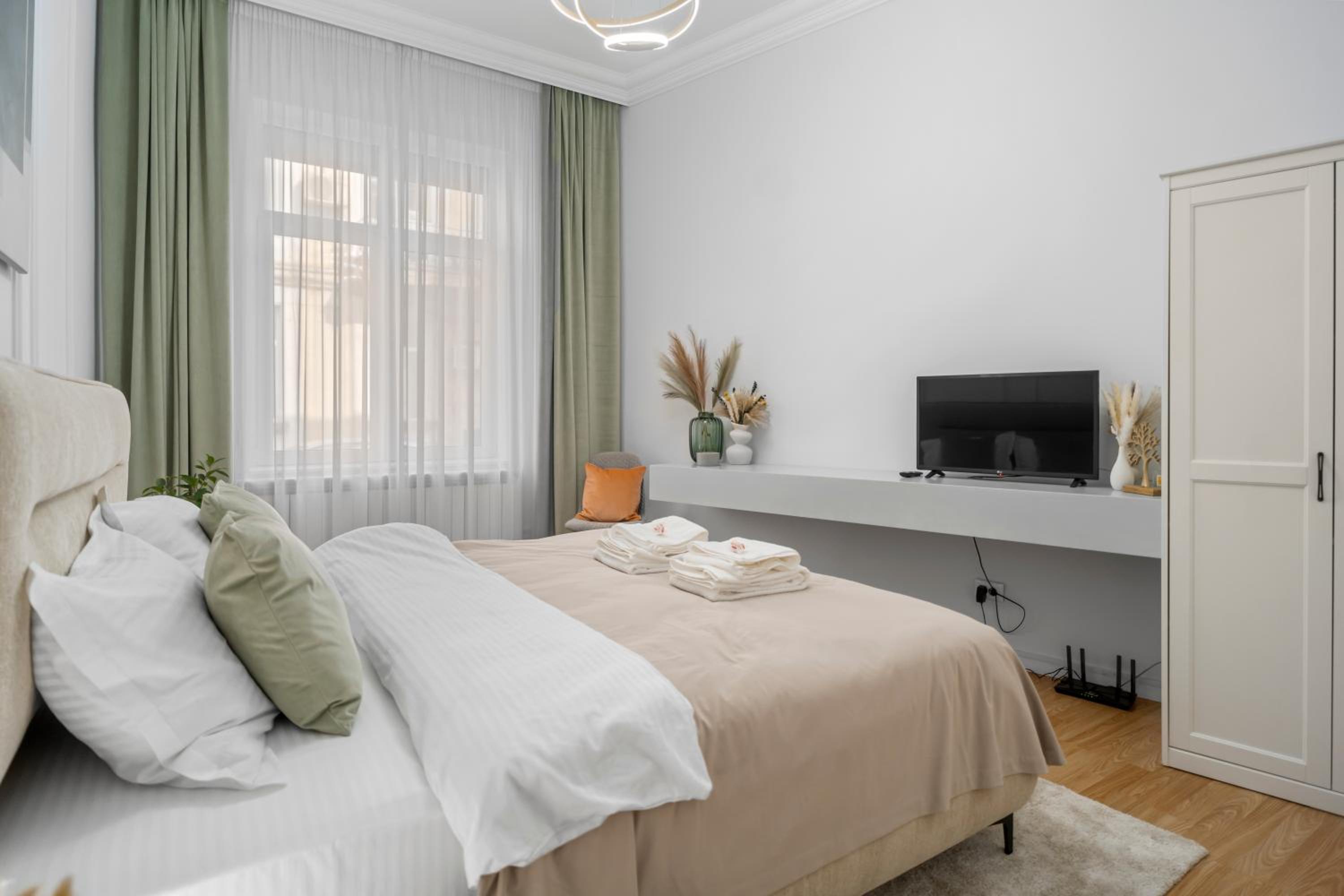 Central Luxury Apartments with Private Garden & Parking