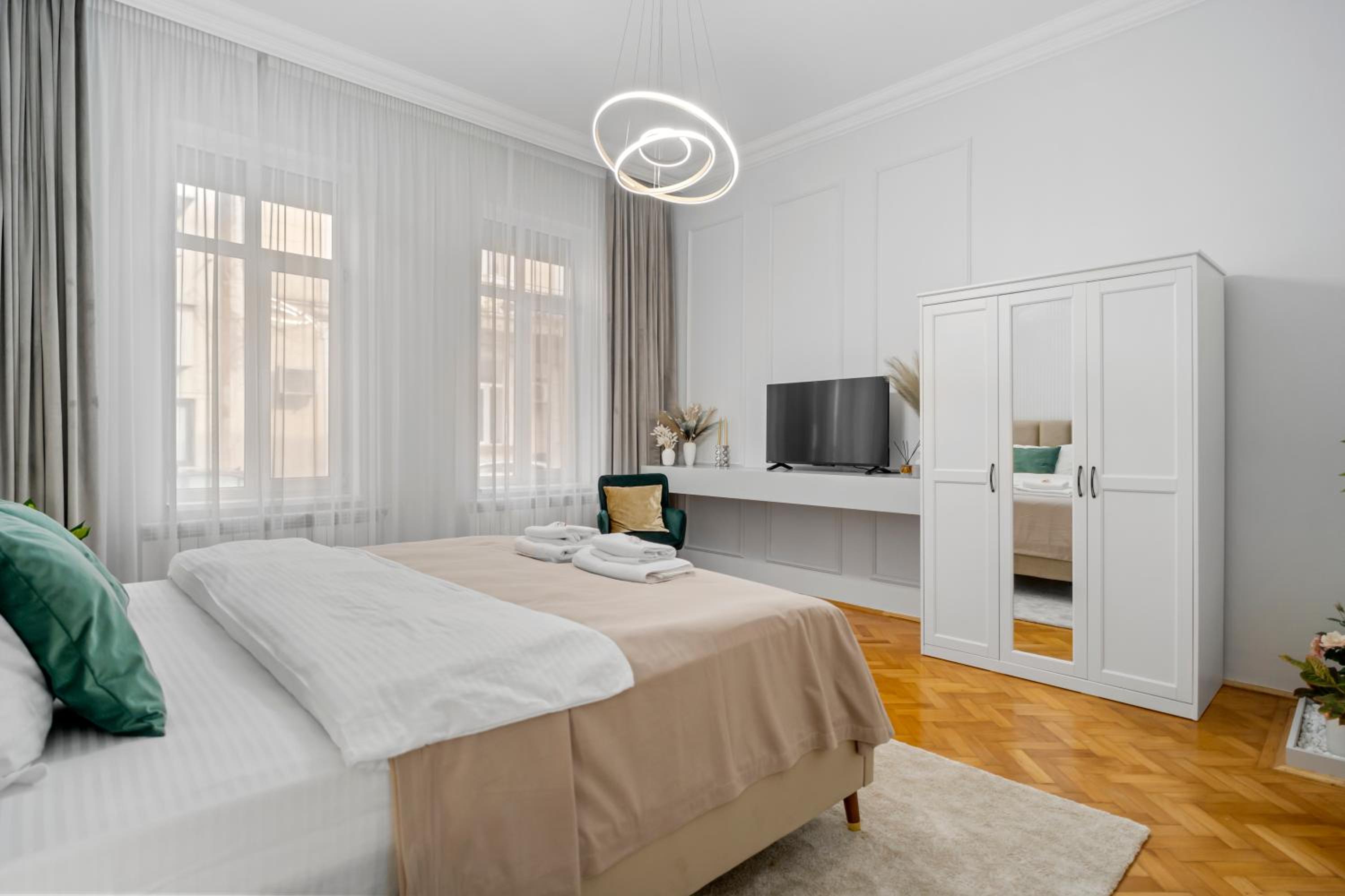 Central Luxury Apartments with Private Garden & Parking