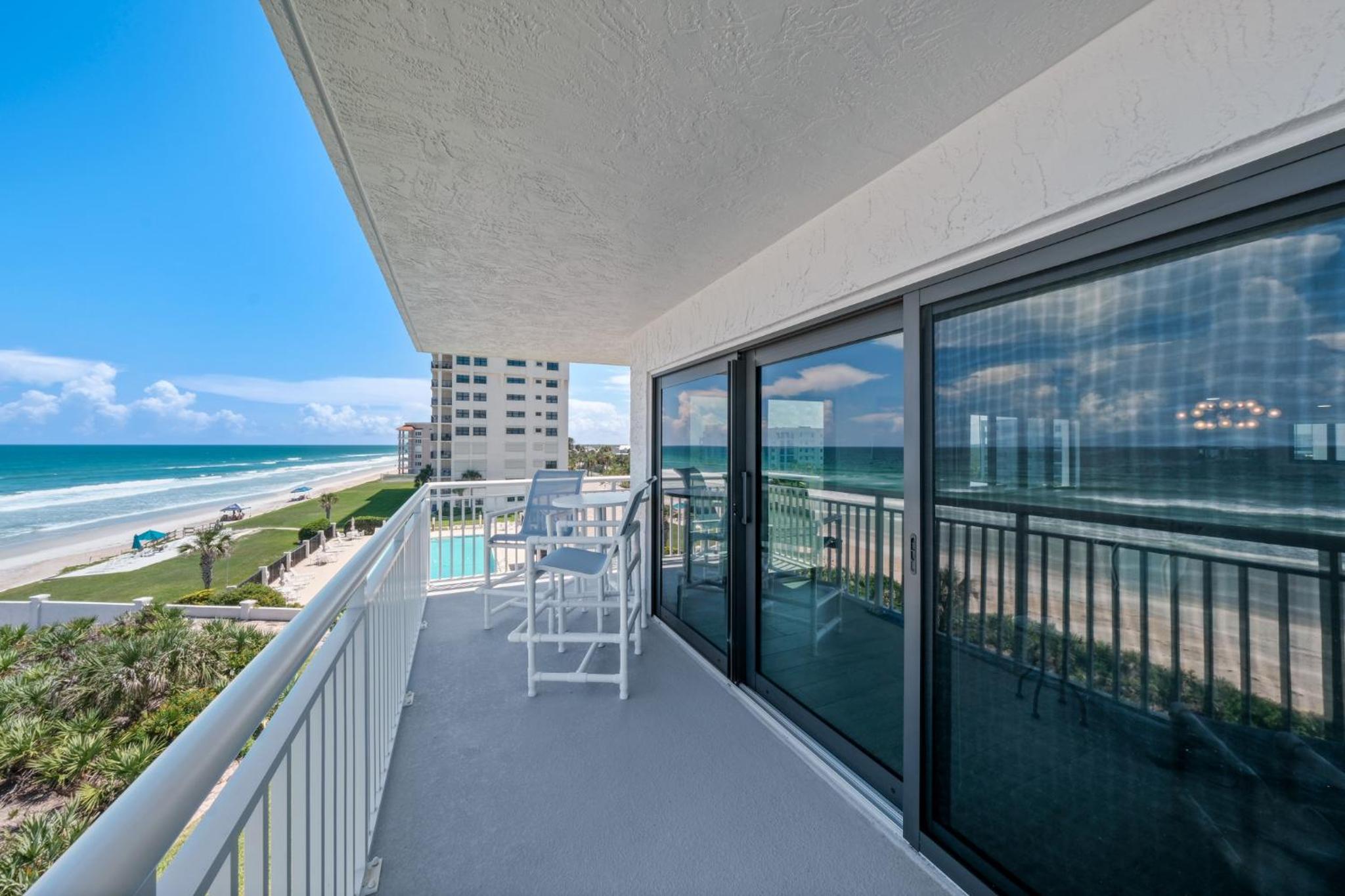 Corner oceanfront views with wrap around balcony located on the no-drive beach!