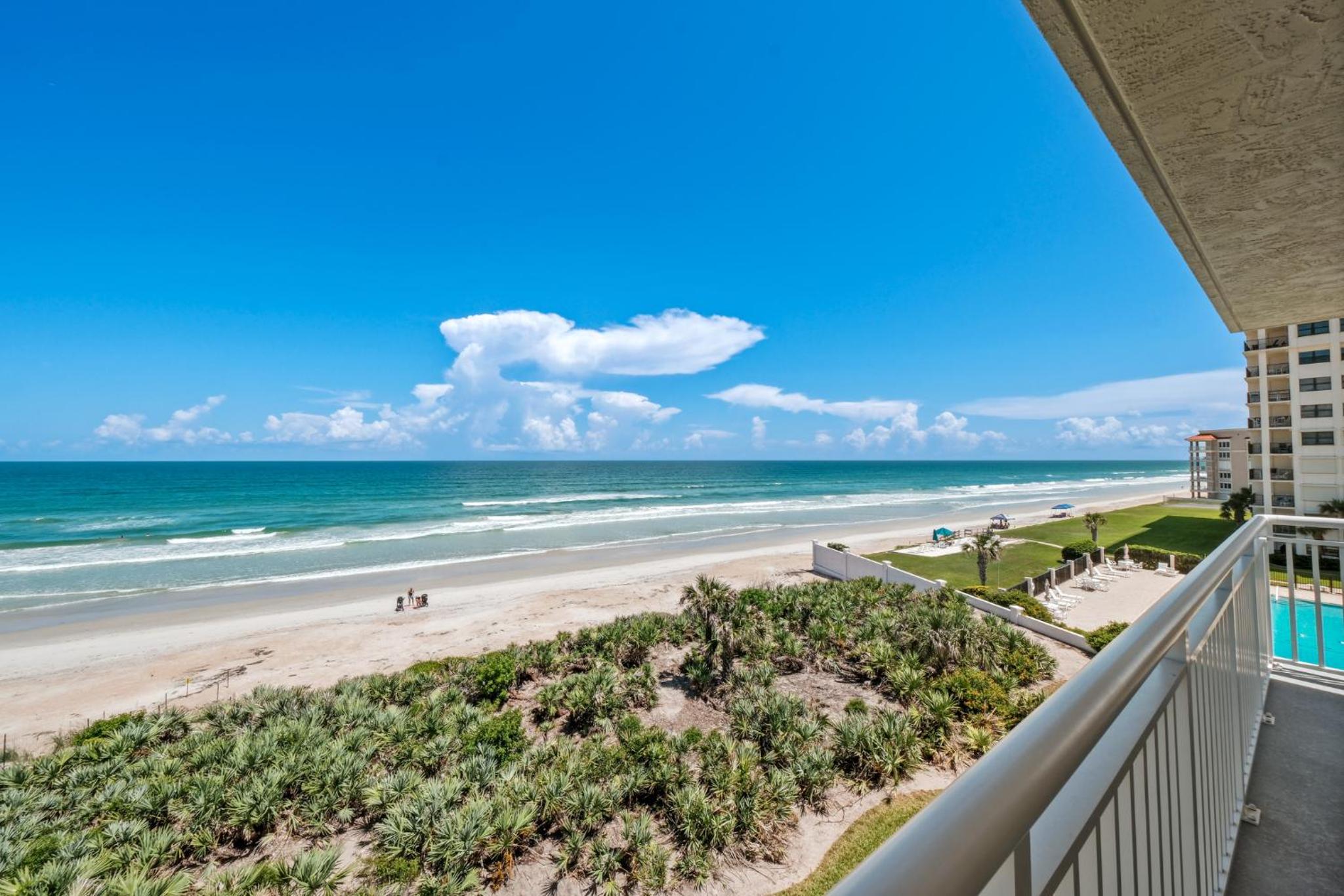 Corner oceanfront views with wrap around balcony located on the no-drive beach!