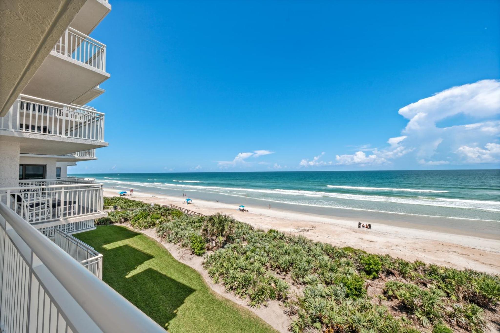 Corner oceanfront views with wrap around balcony located on the no-drive beach!