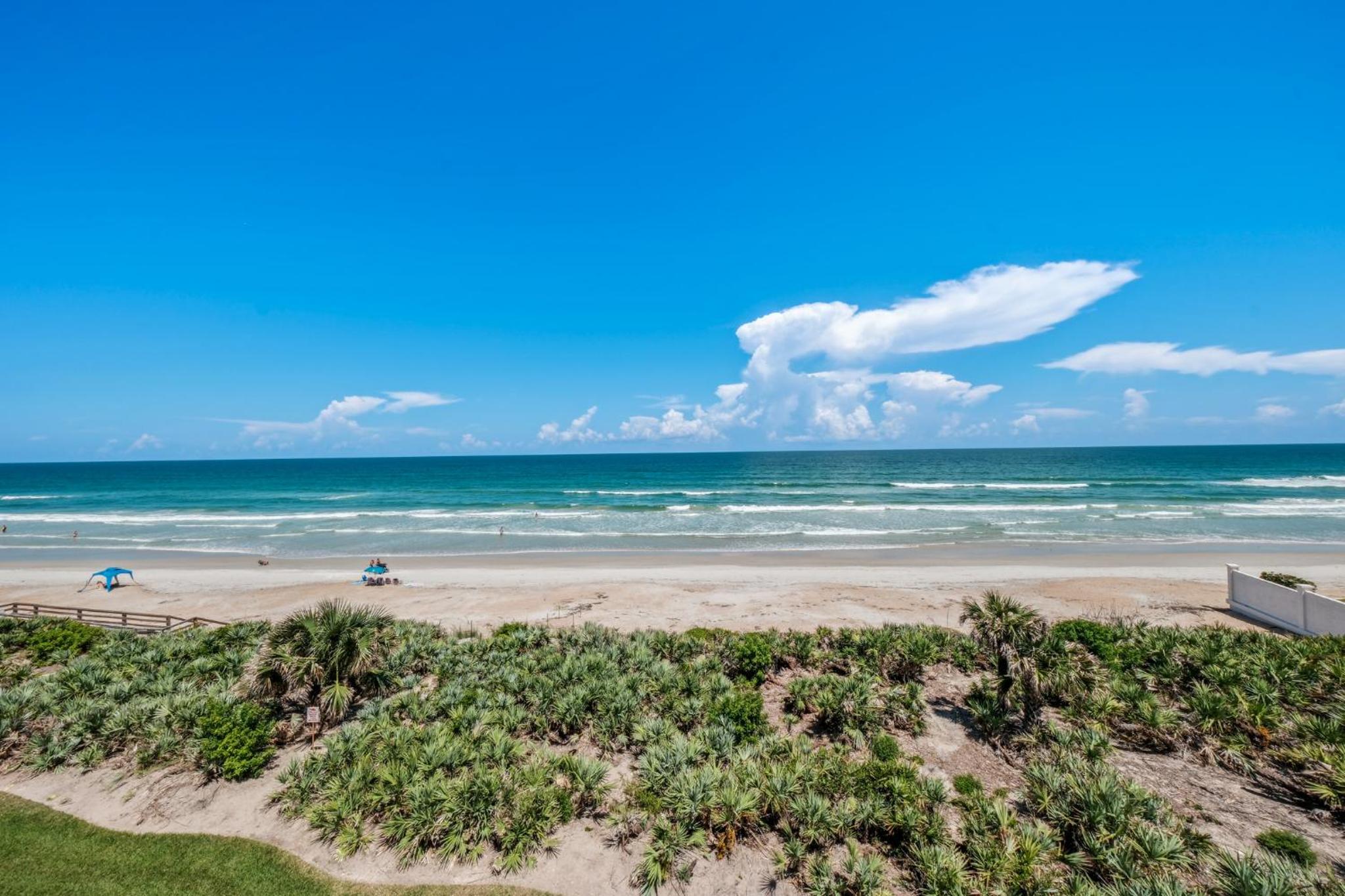 Corner oceanfront views with wrap around balcony located on the no-drive beach!