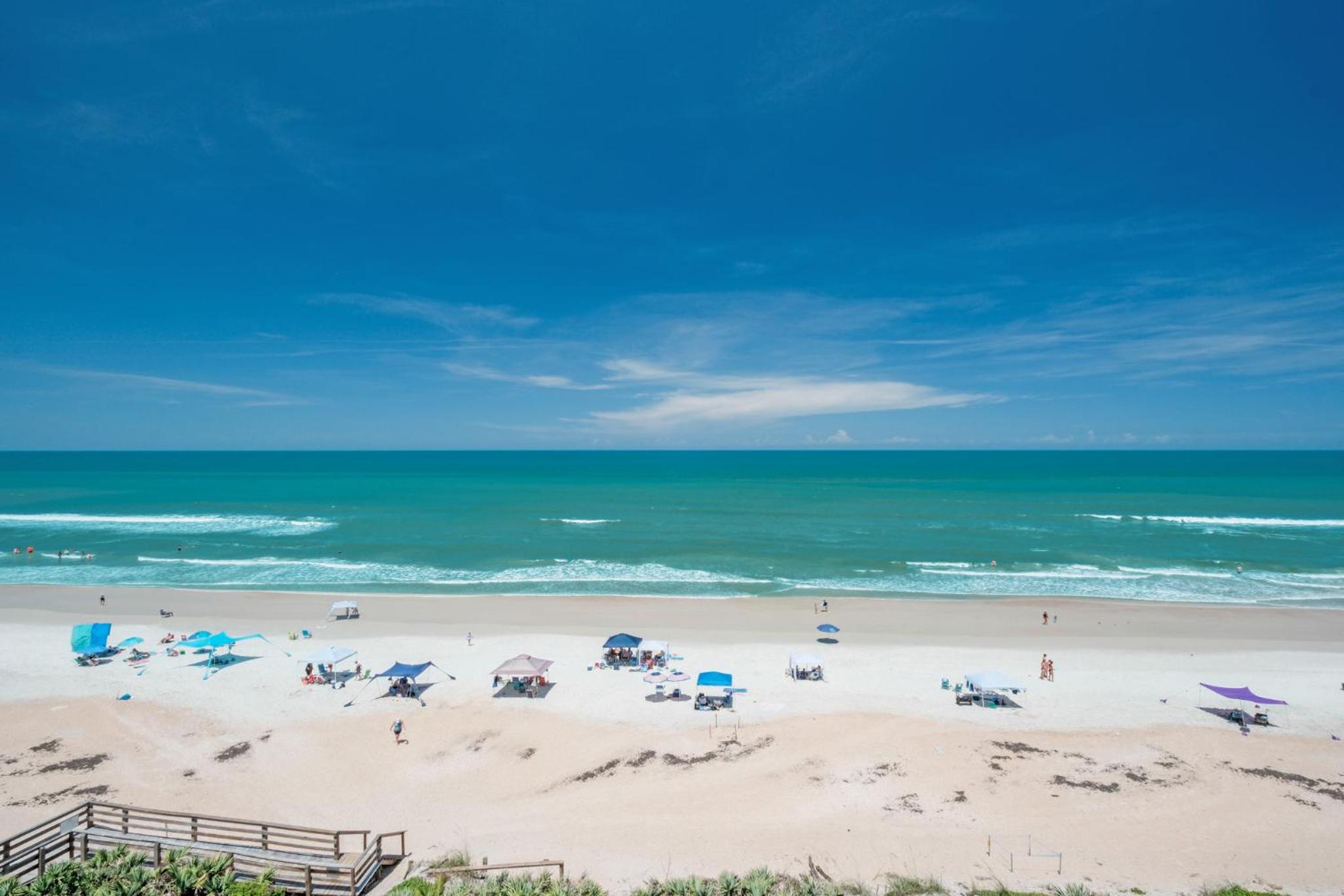 Large oceanfront balcony with pool & beach access located on the no-drive beach!