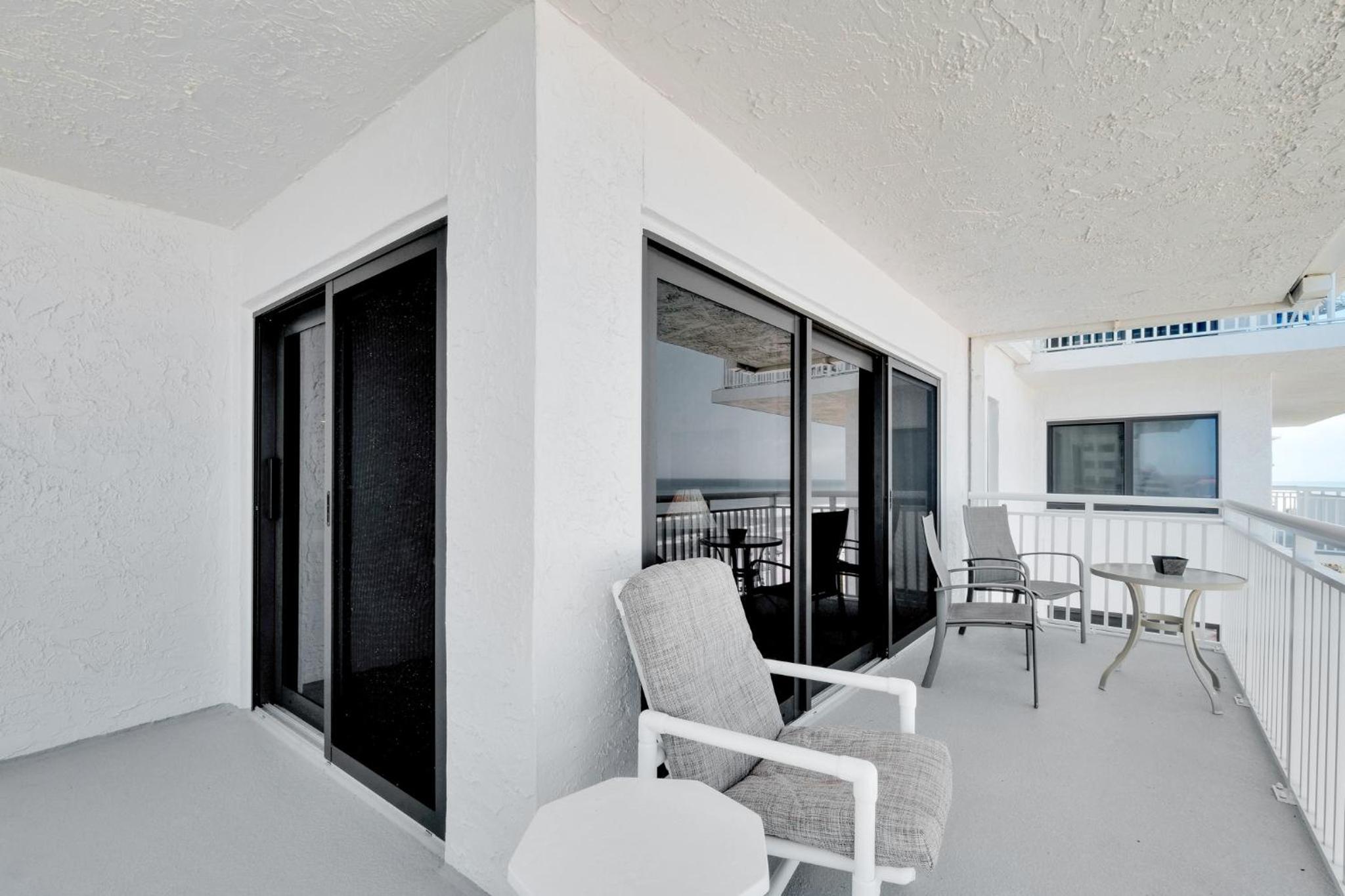 Large oceanfront balcony with pool & beach access located on the no-drive beach!