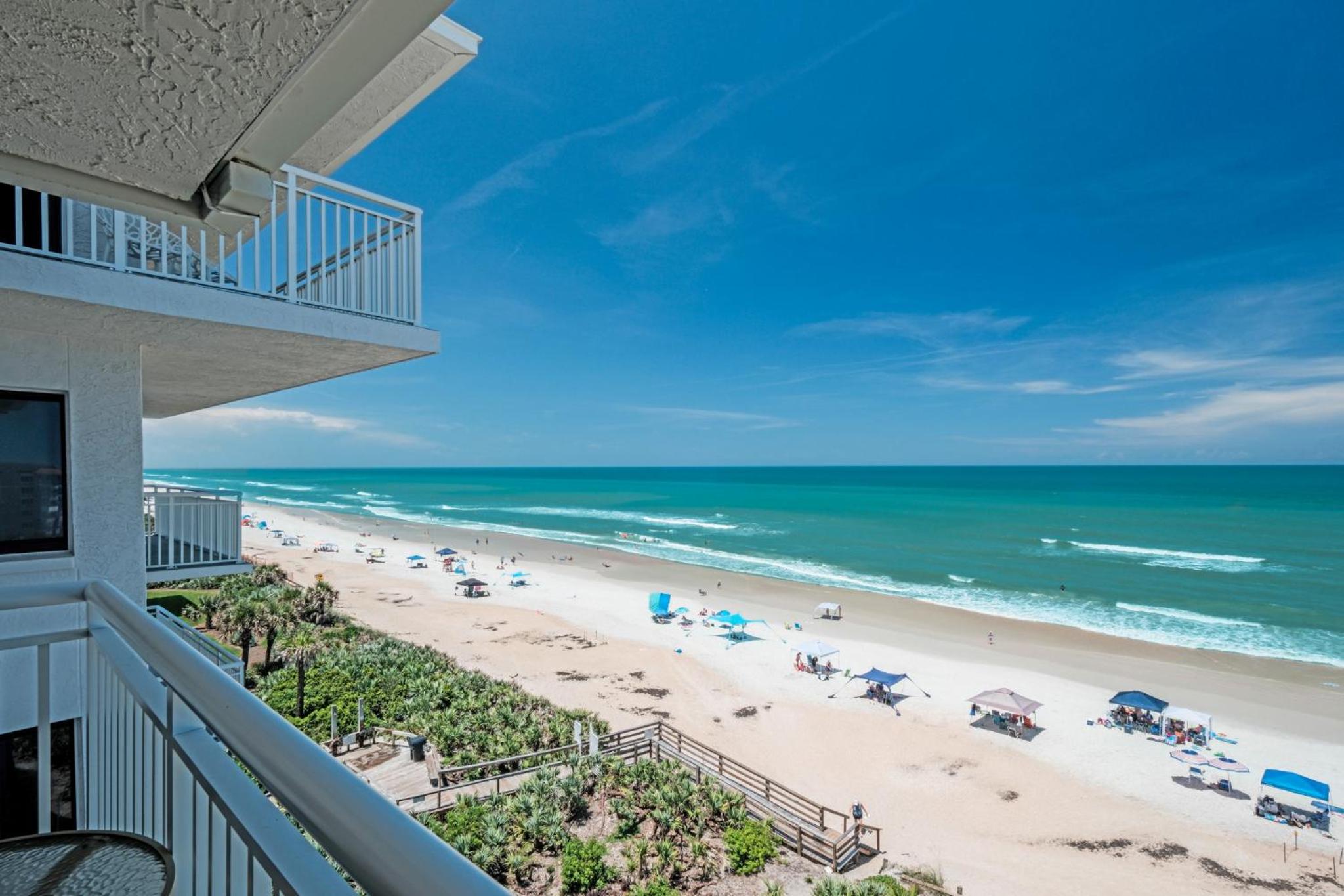 Large oceanfront balcony with pool & beach access located on the no-drive beach!