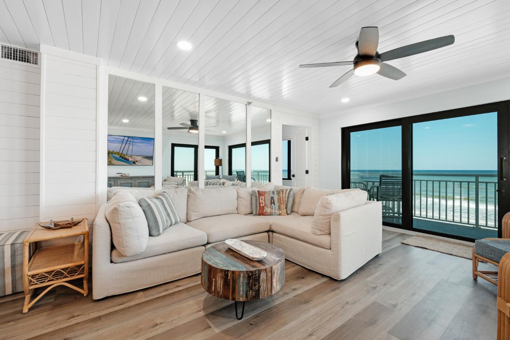 Large balcony with direct oceanfront views and access to complex pool