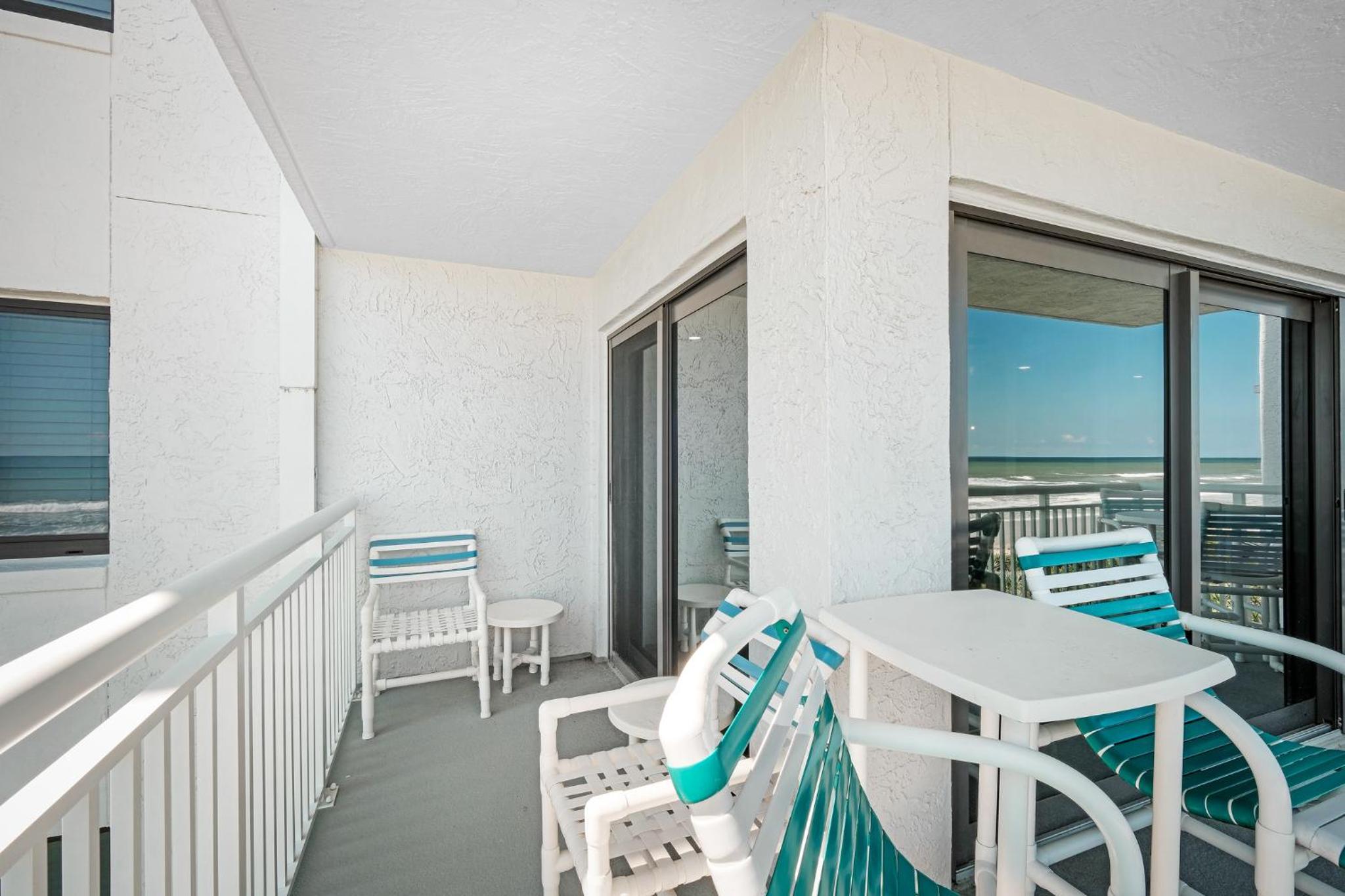 Large balcony with direct oceanfront views and access to complex pool