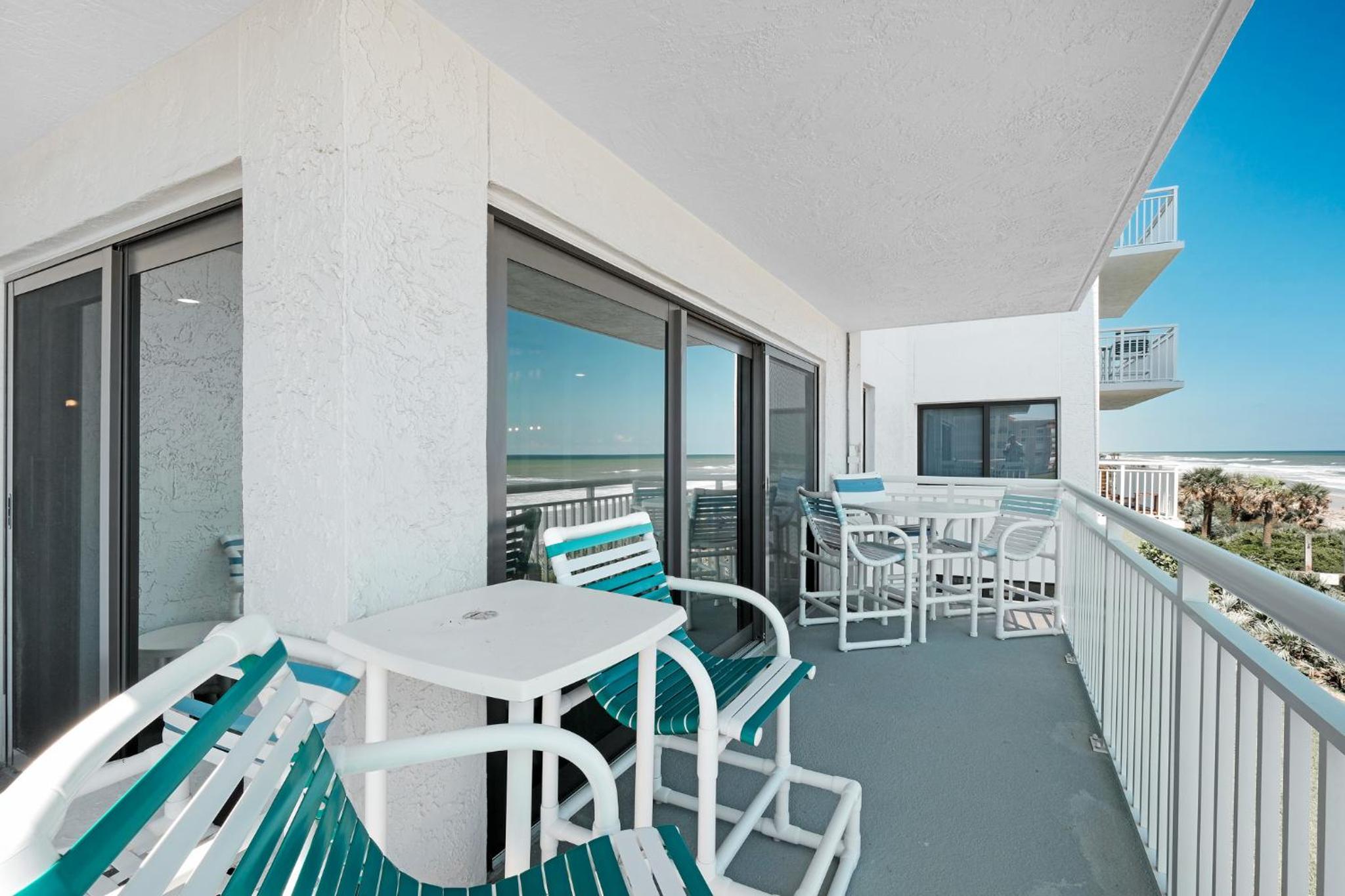 Large balcony with direct oceanfront views and access to complex pool