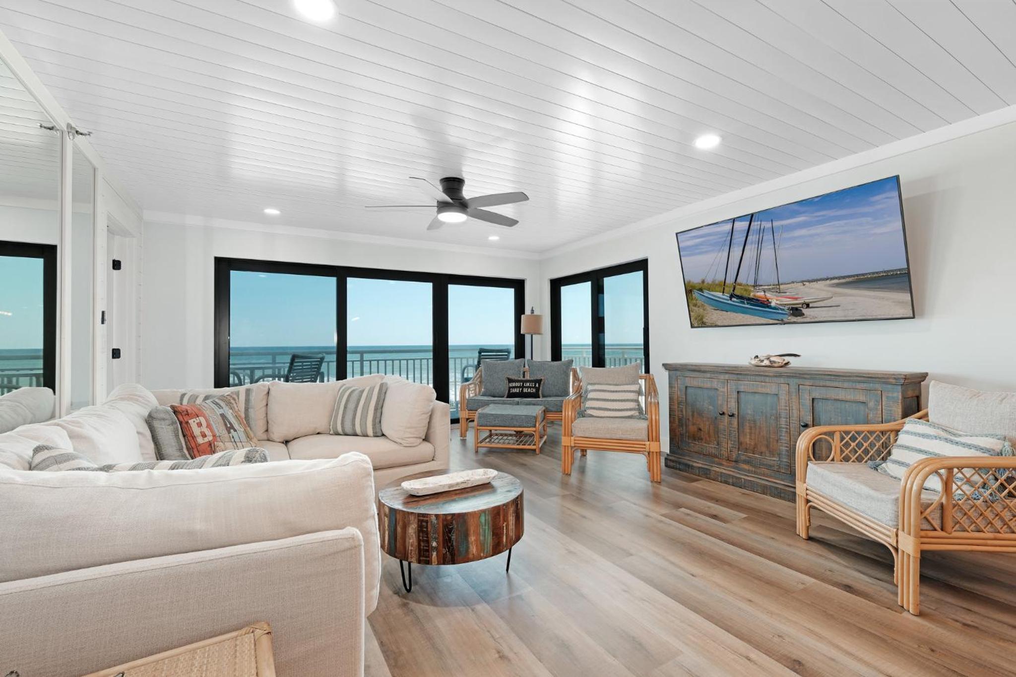 Large balcony with direct oceanfront views and access to complex pool