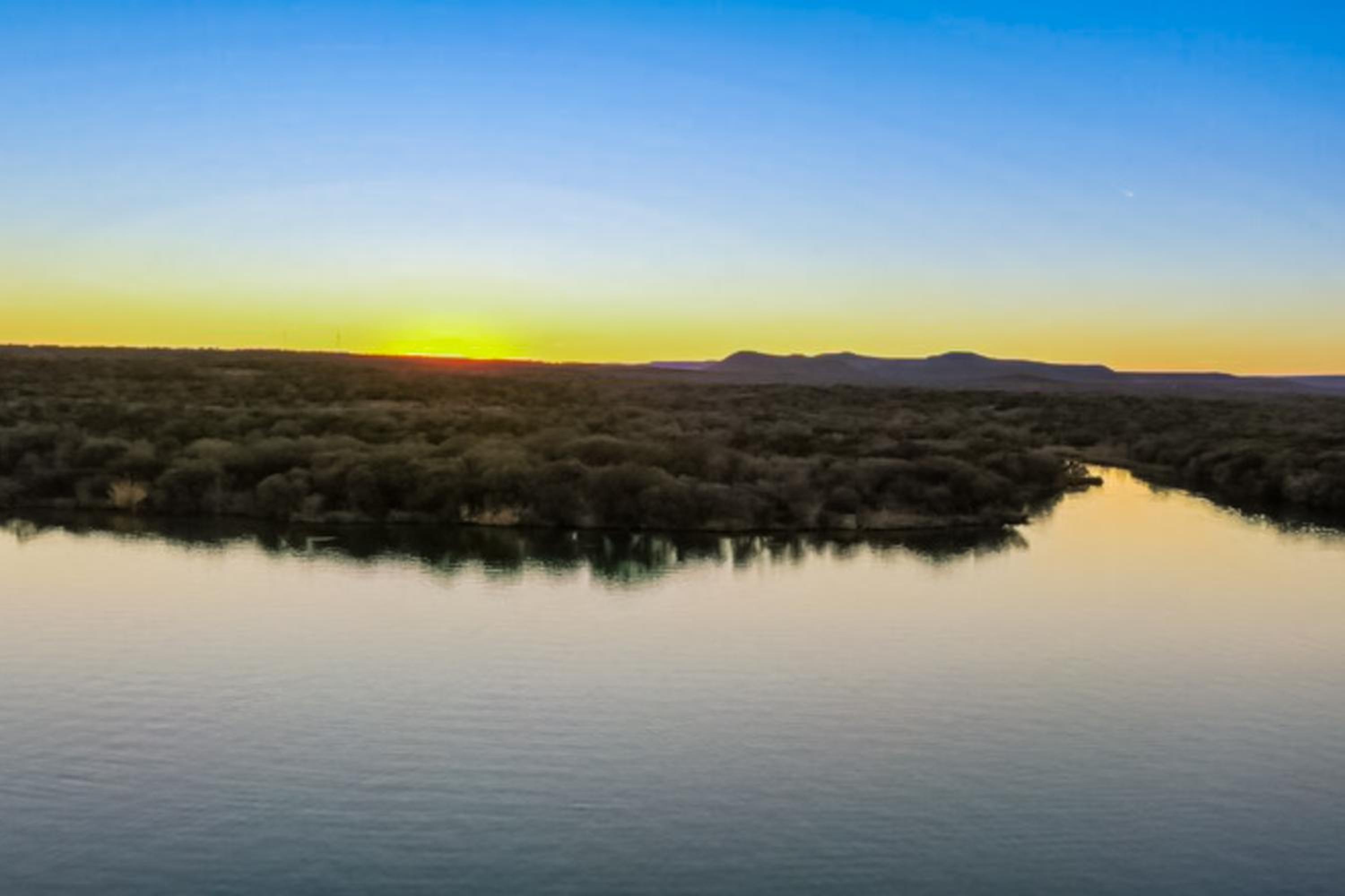 Open Water Sunset Kingsland Lakehouse with Boat Slip