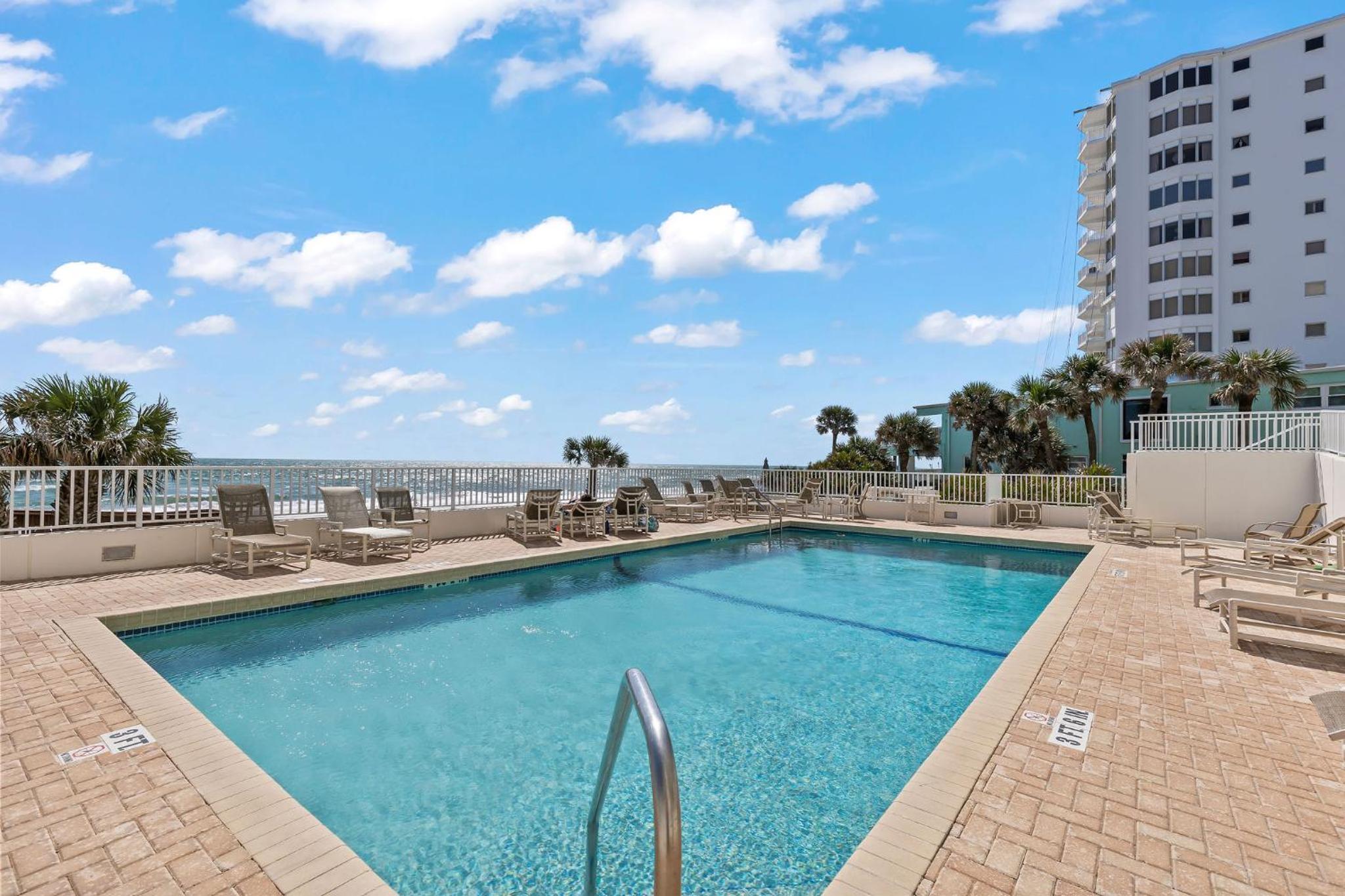 Direct oceanfront corner condo with spacious balcony and heated beachfront pool