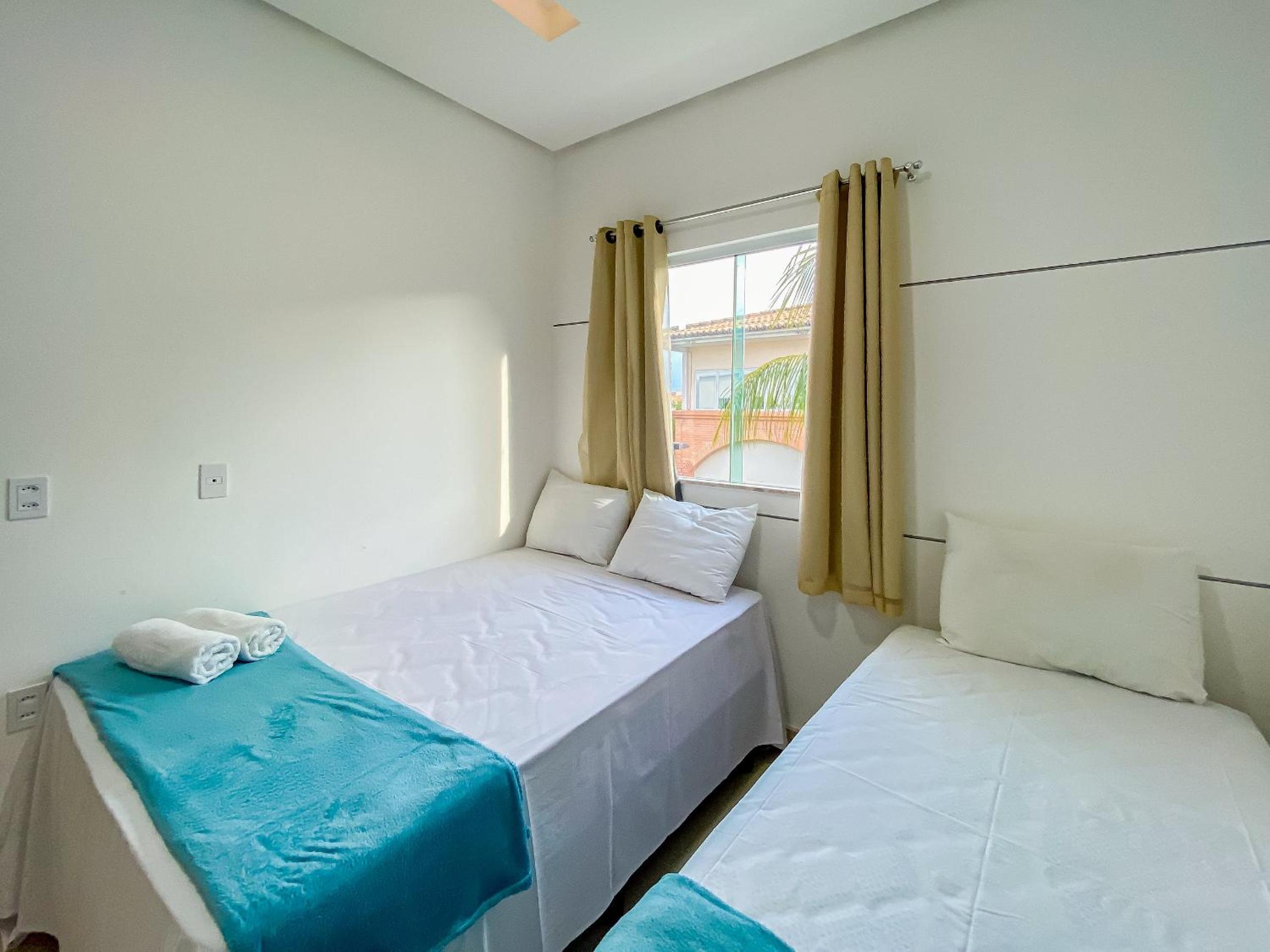 Casa com 4 quartos em condomínio com piscina e área gourmet próximo à praia de Taperapuã