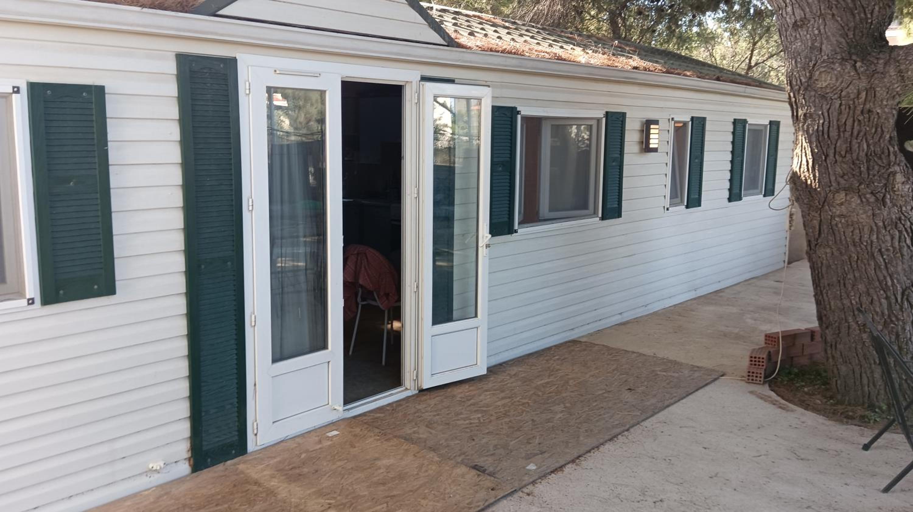 Family mobile home solar powered near the sea and the airport