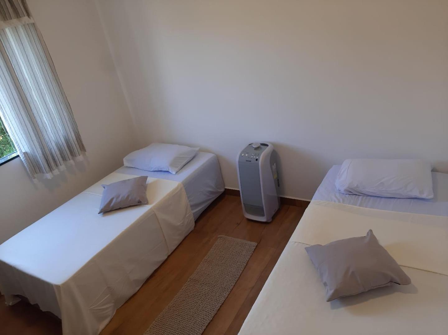 Jeito Mineiro, privacidade para família e grupos -2 quartos- melhor custo-benefício, garagem, sala com cozinha integrada, aconchegante, ambiente moderno e 