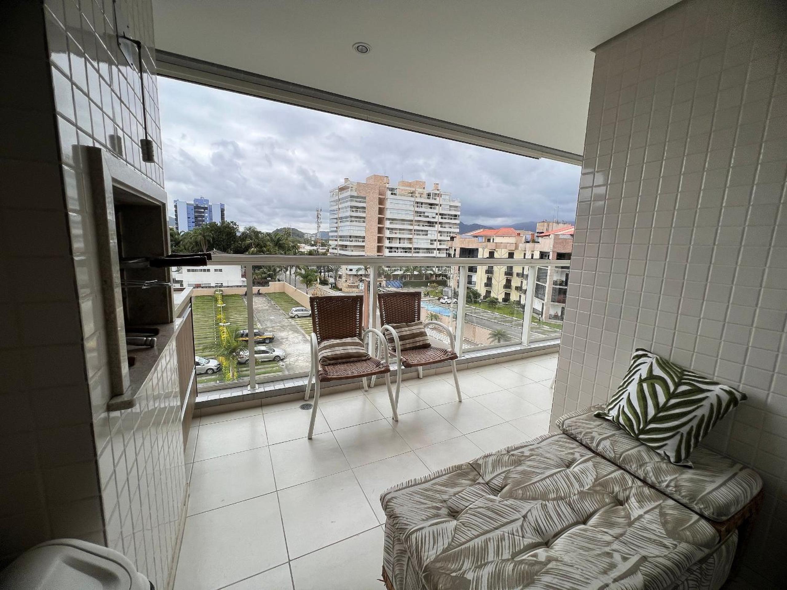 Home 12| Ap piscina aquecida pé na areia Bertioga