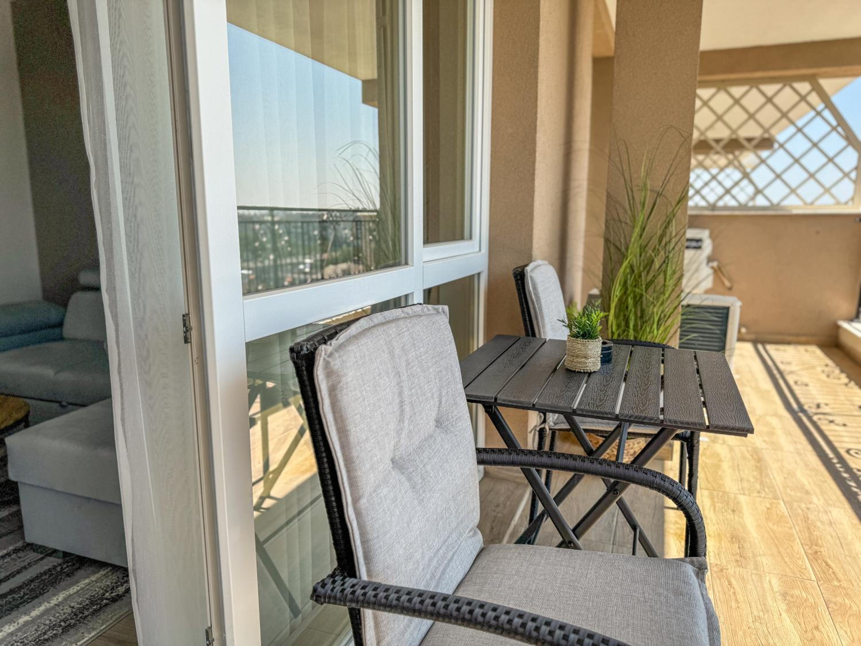 1BR Apartment with Panoramic View Balcony and Designated Parking Space