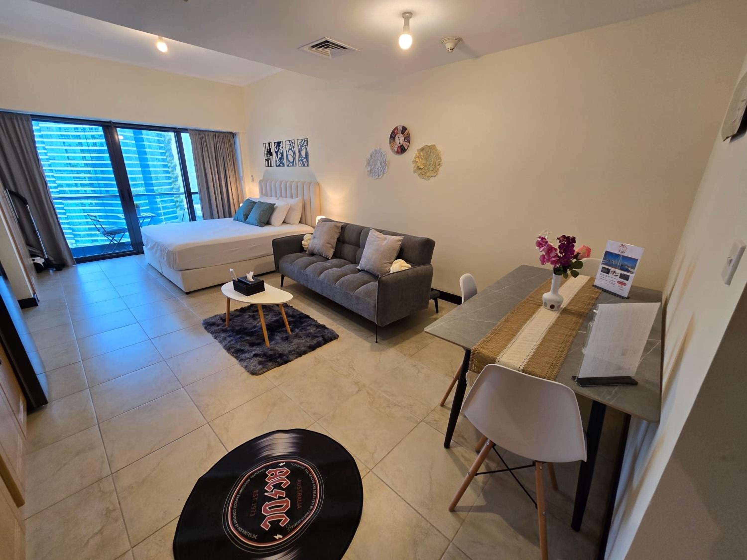 Click Stay - JLT - Entire Studio & Balcony Lakes view Apartment -NA