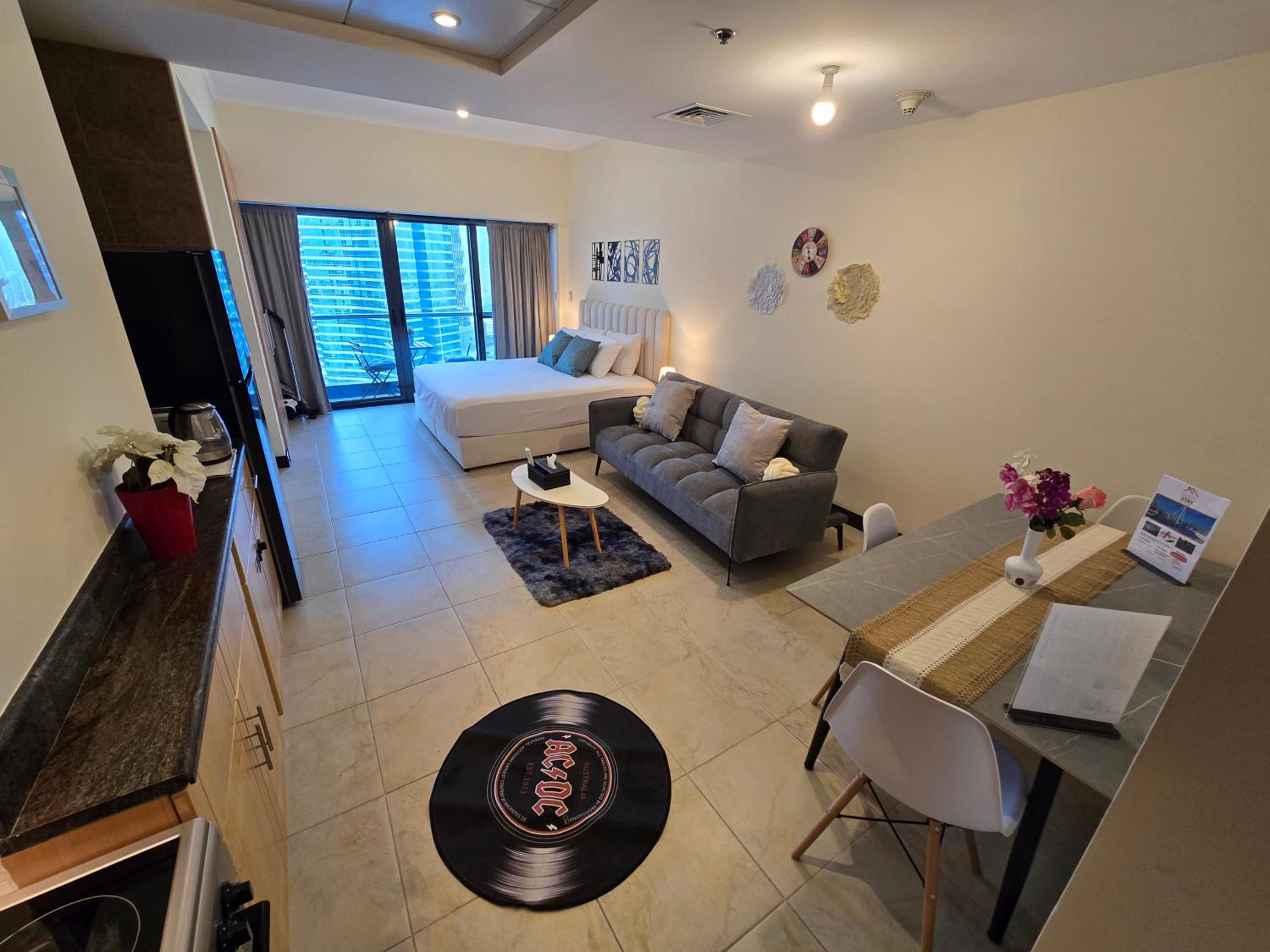 Click Stay - JLT - Entire Studio & Balcony Lakes view Apartment -NA