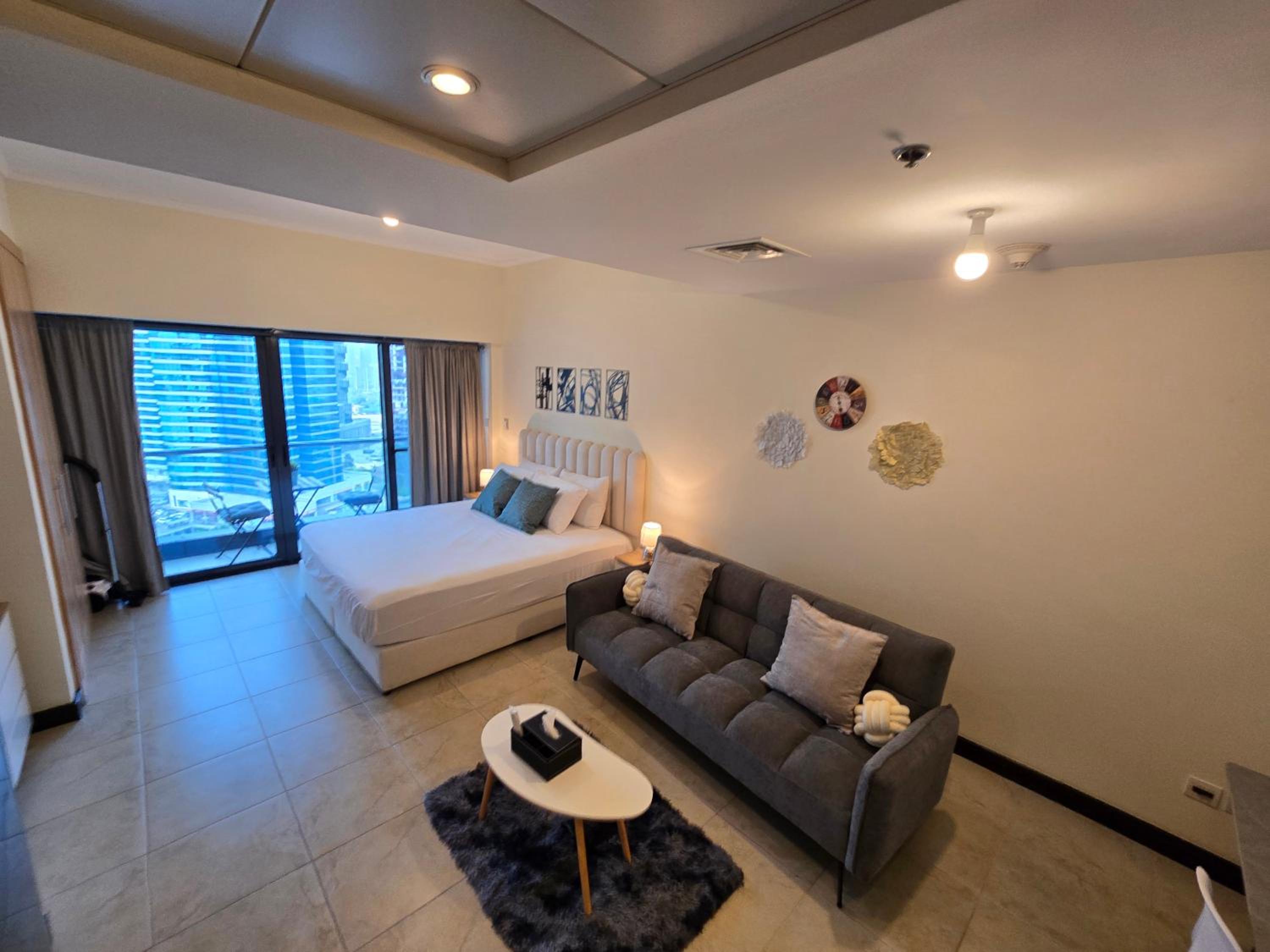 Click Stay - JLT - Entire Studio & Balcony Lakes view Apartment -NA